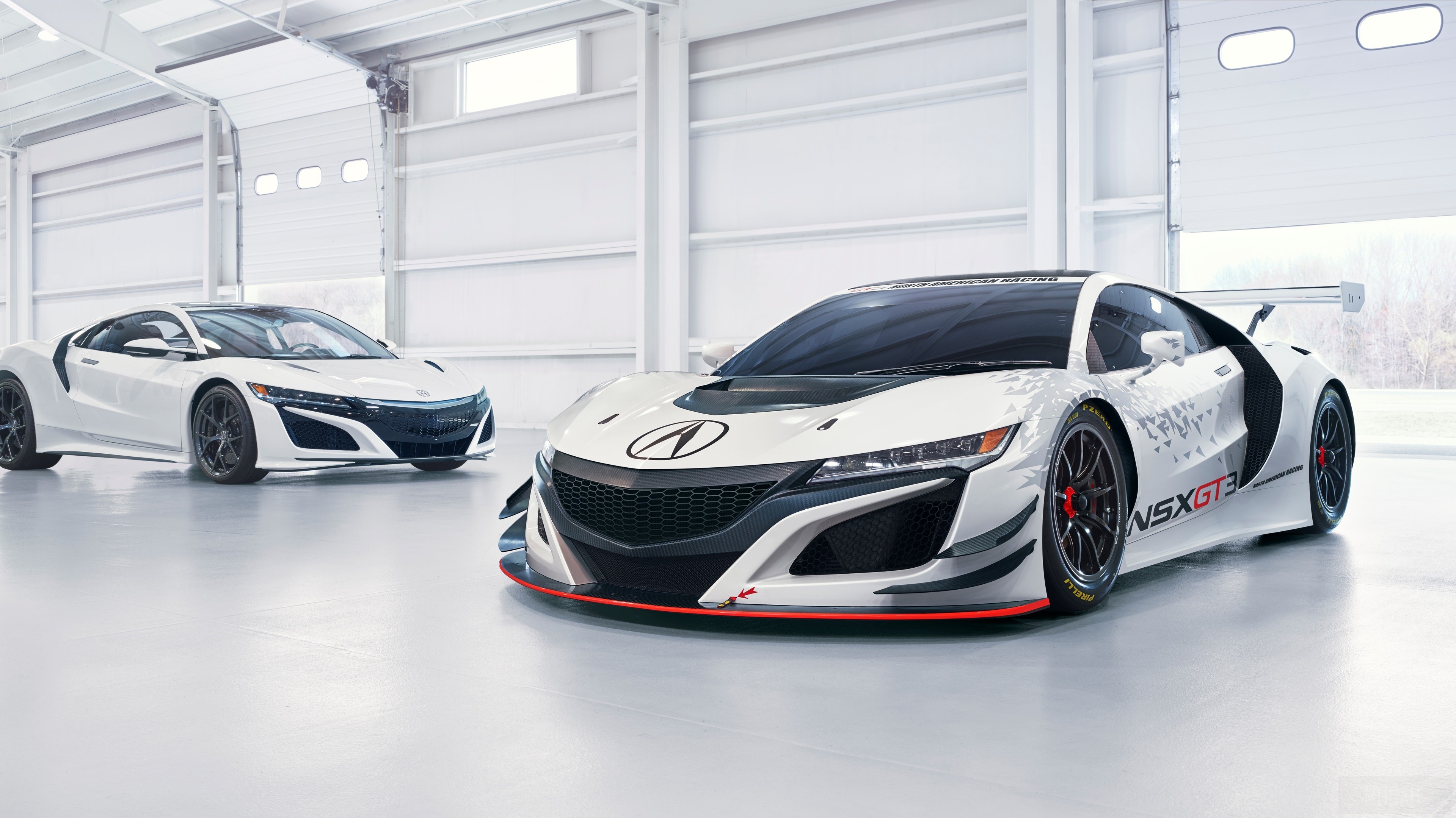 Two white Acura NSX GT3 race cars in a garage HD Wallpaper