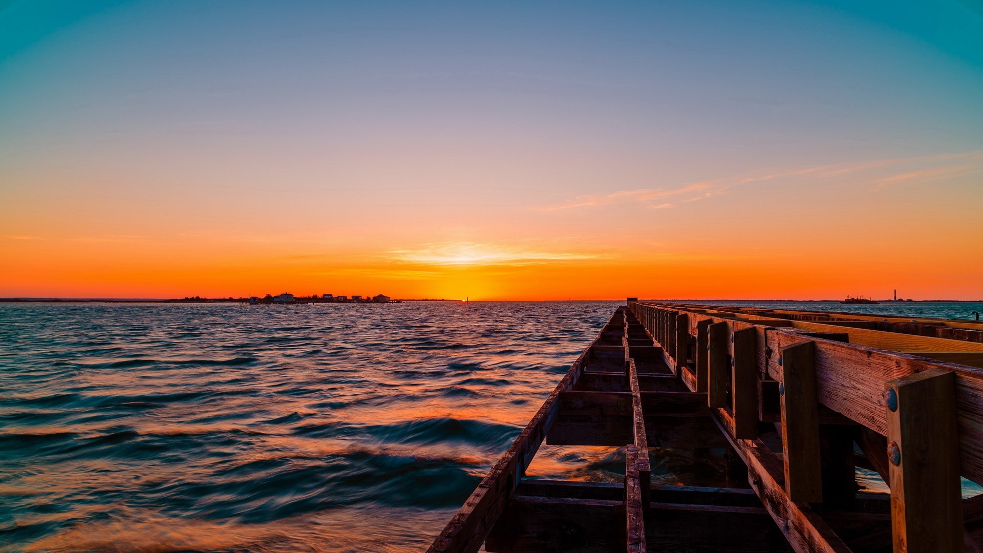 Wooden pier over the ocean at sunset HD Wallpaper