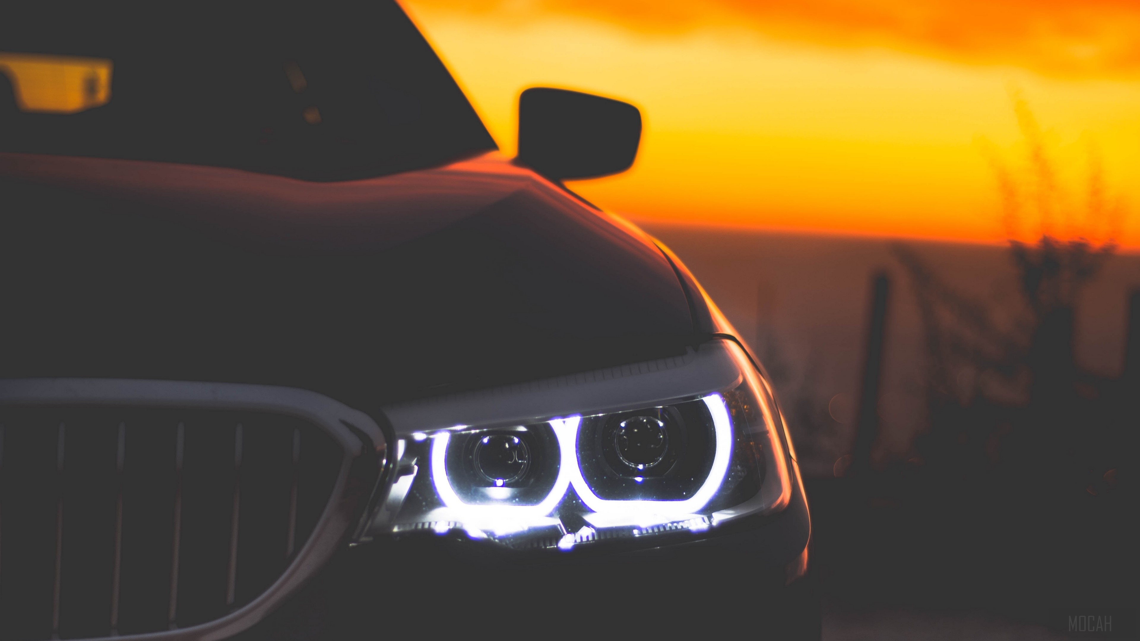 BMW headlights at sunset 4K HD Wallpaper
