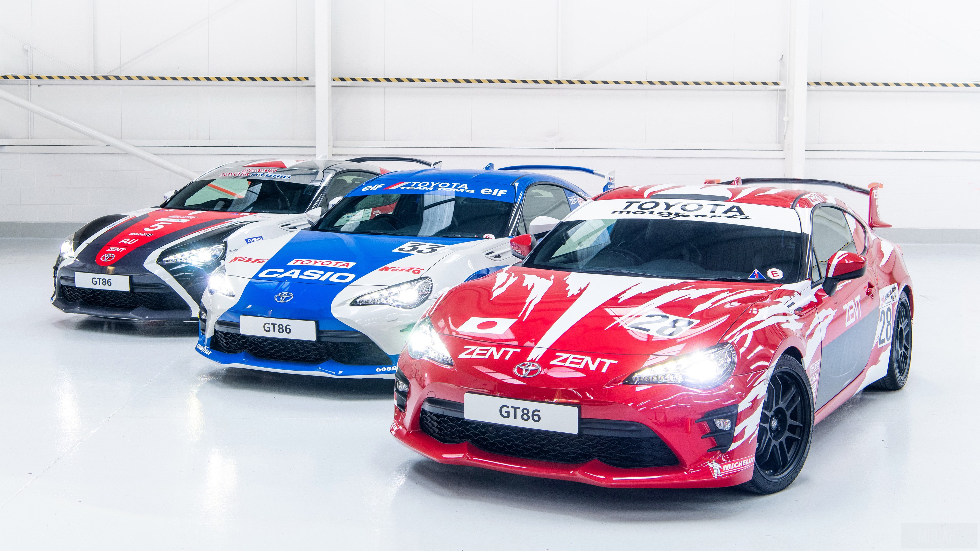 Toyota GT86 race cars in a hangar HD Wallpaper