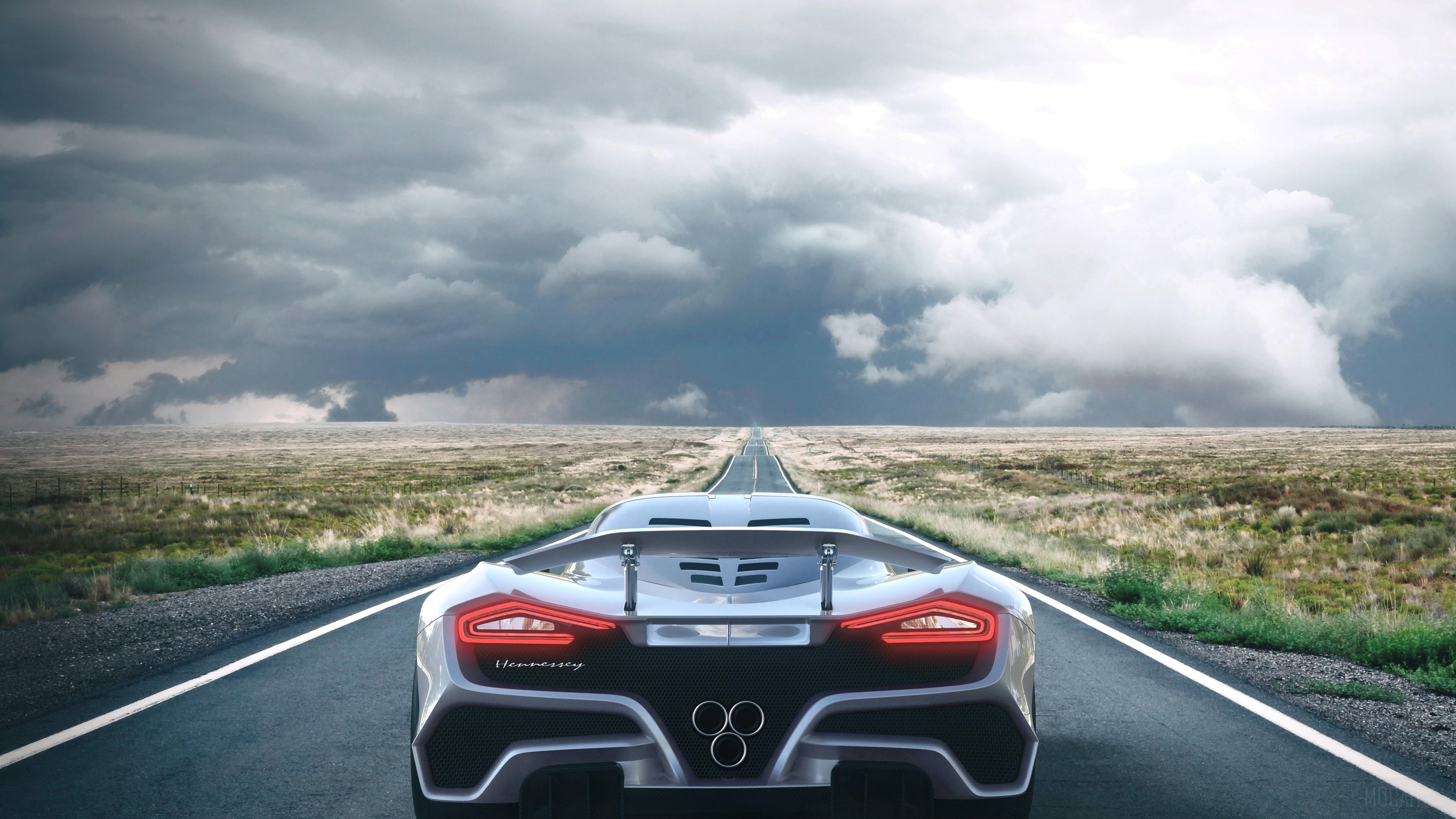Hennessey Venom F5 Driving on a Road Under Stormy Skies 4K HD Wallpaper