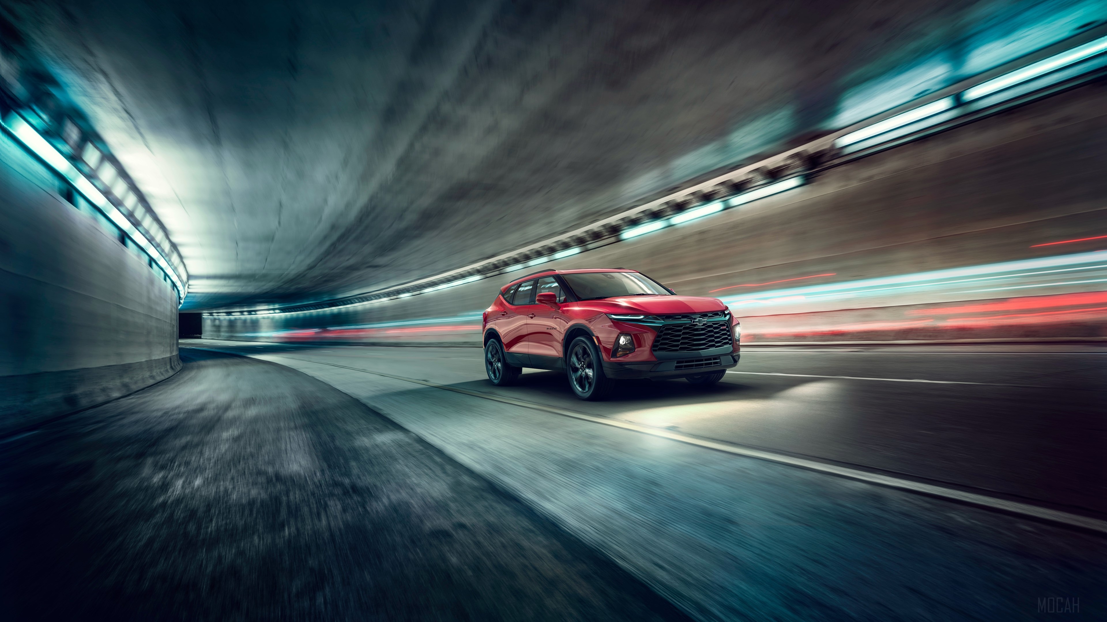 Red Chevrolet Blazer driving through a tunnel HD Wallpaper