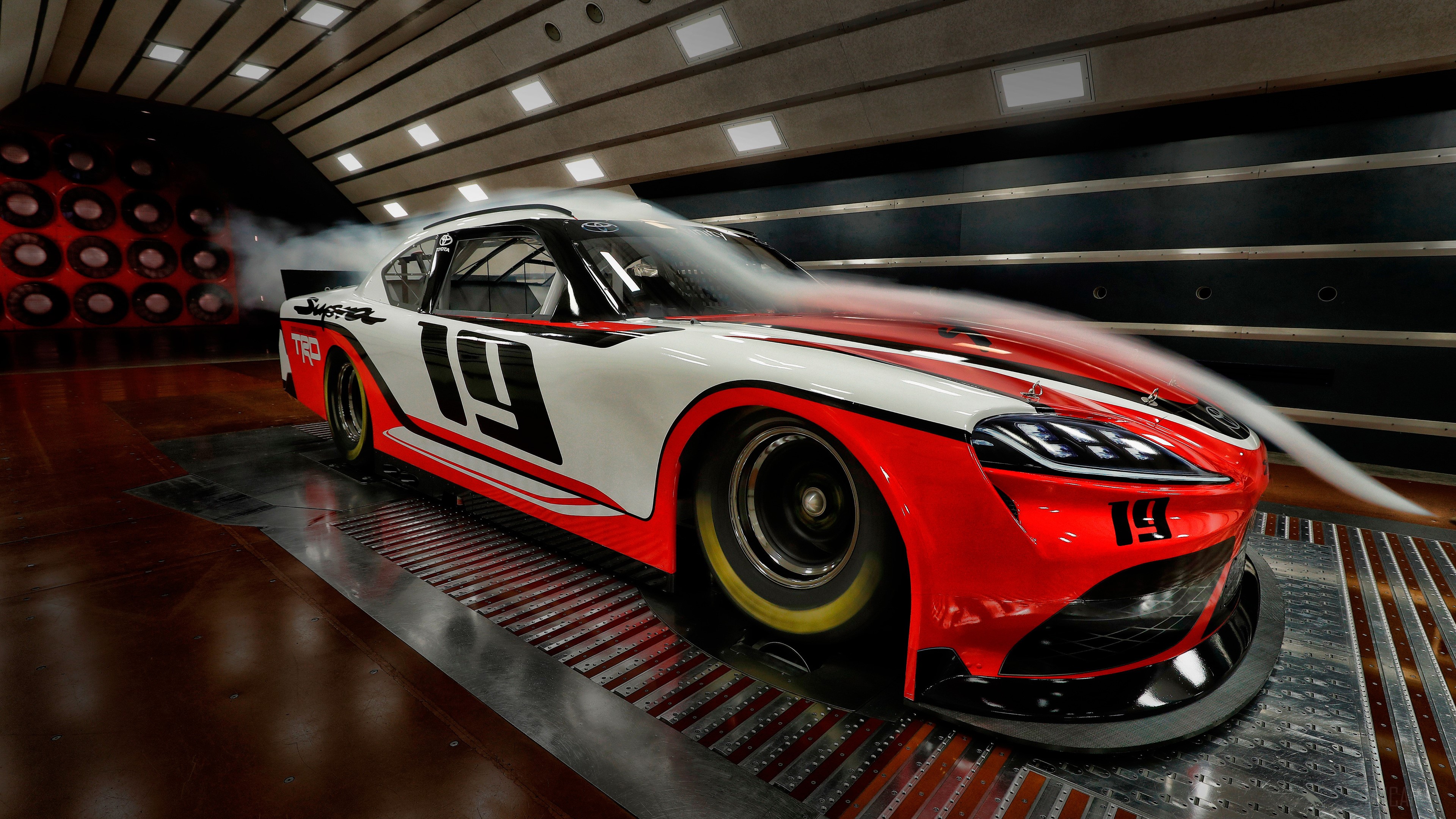 Toyota Supra Xfinity race car in wind tunnel 4K HD Wallpaper