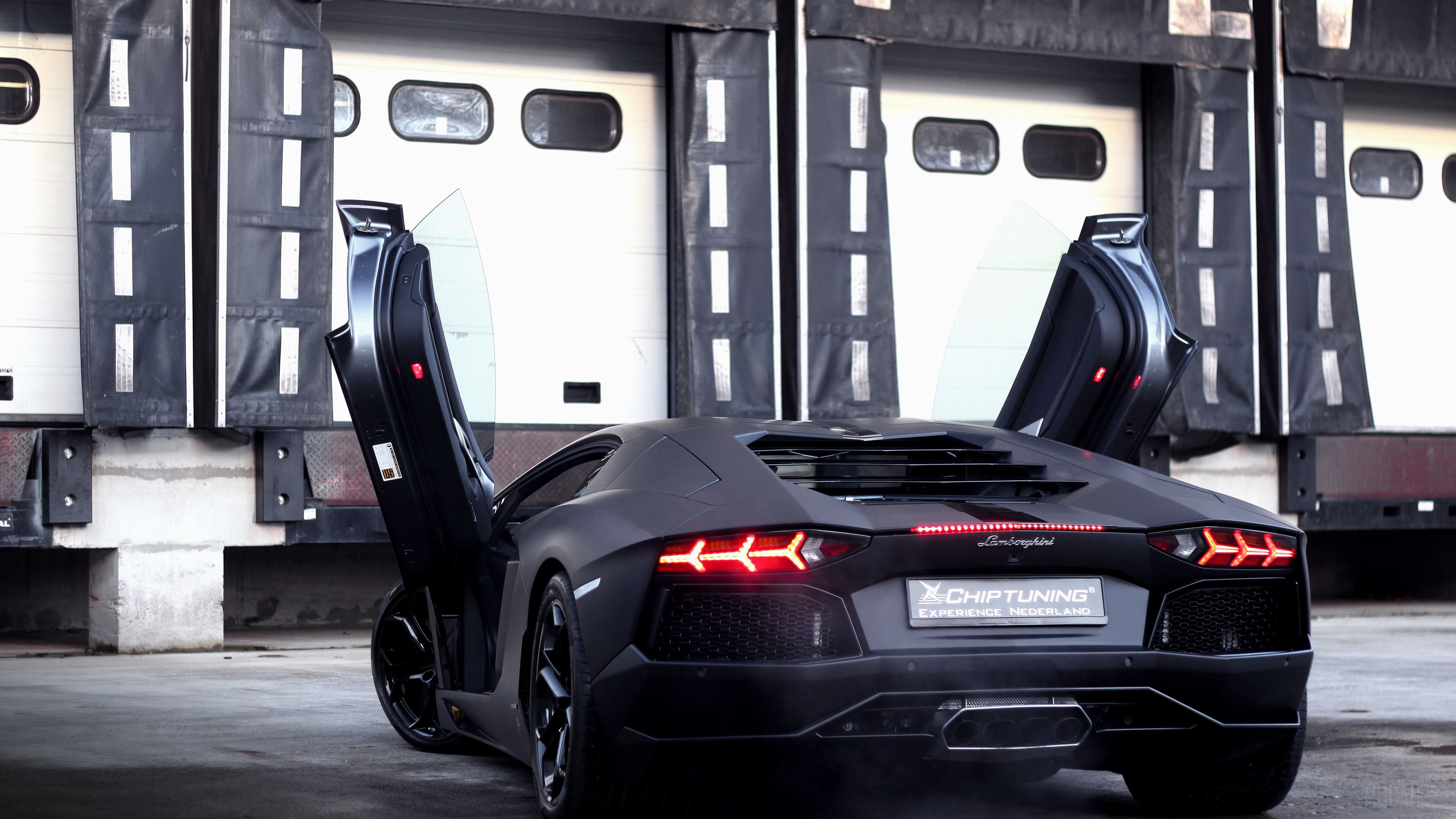 Matte black Lamborghini Aventador with doors open 4K HD Wallpaper