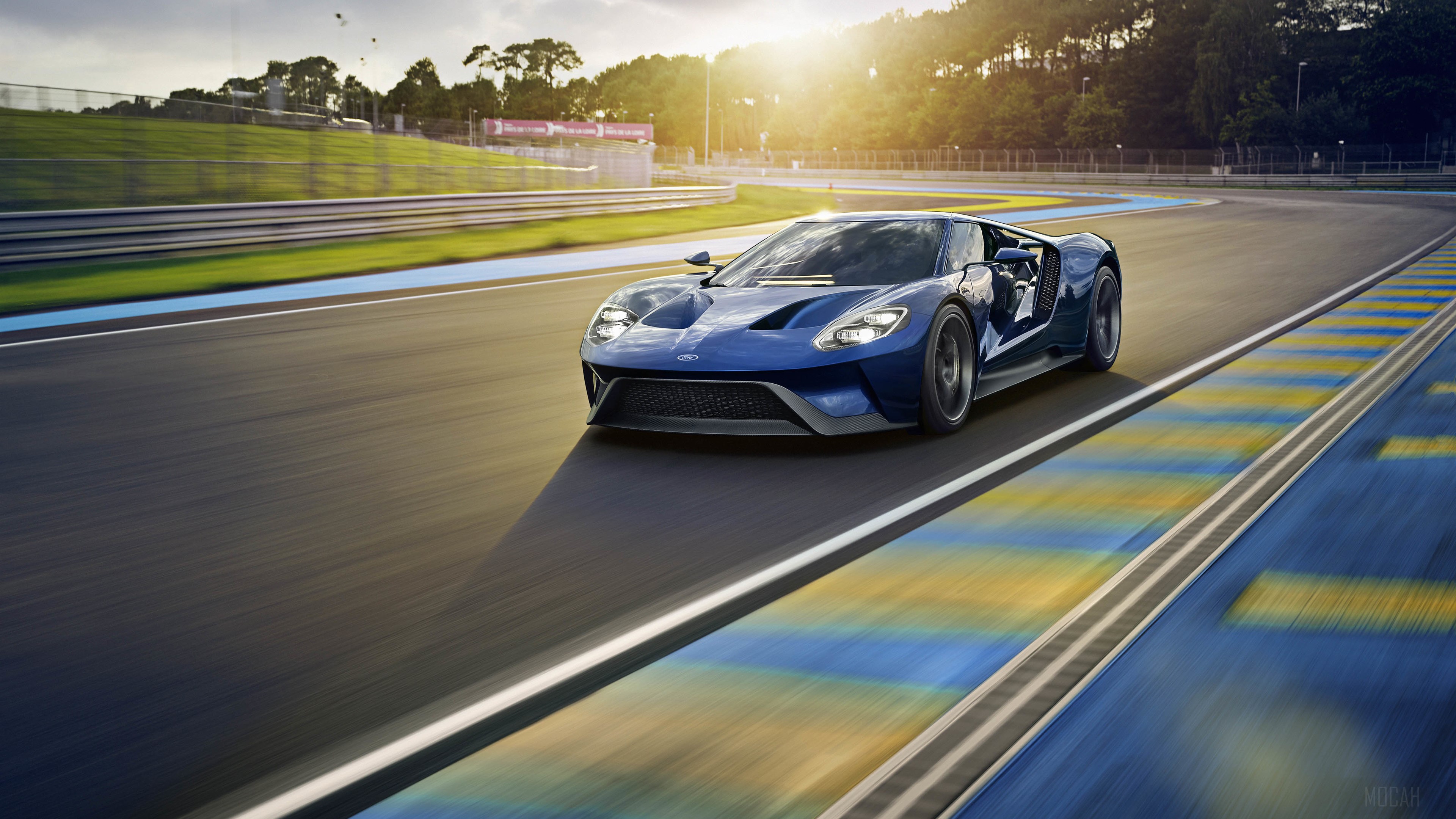 Blue Ford GT driving on a race track HD Wallpaper