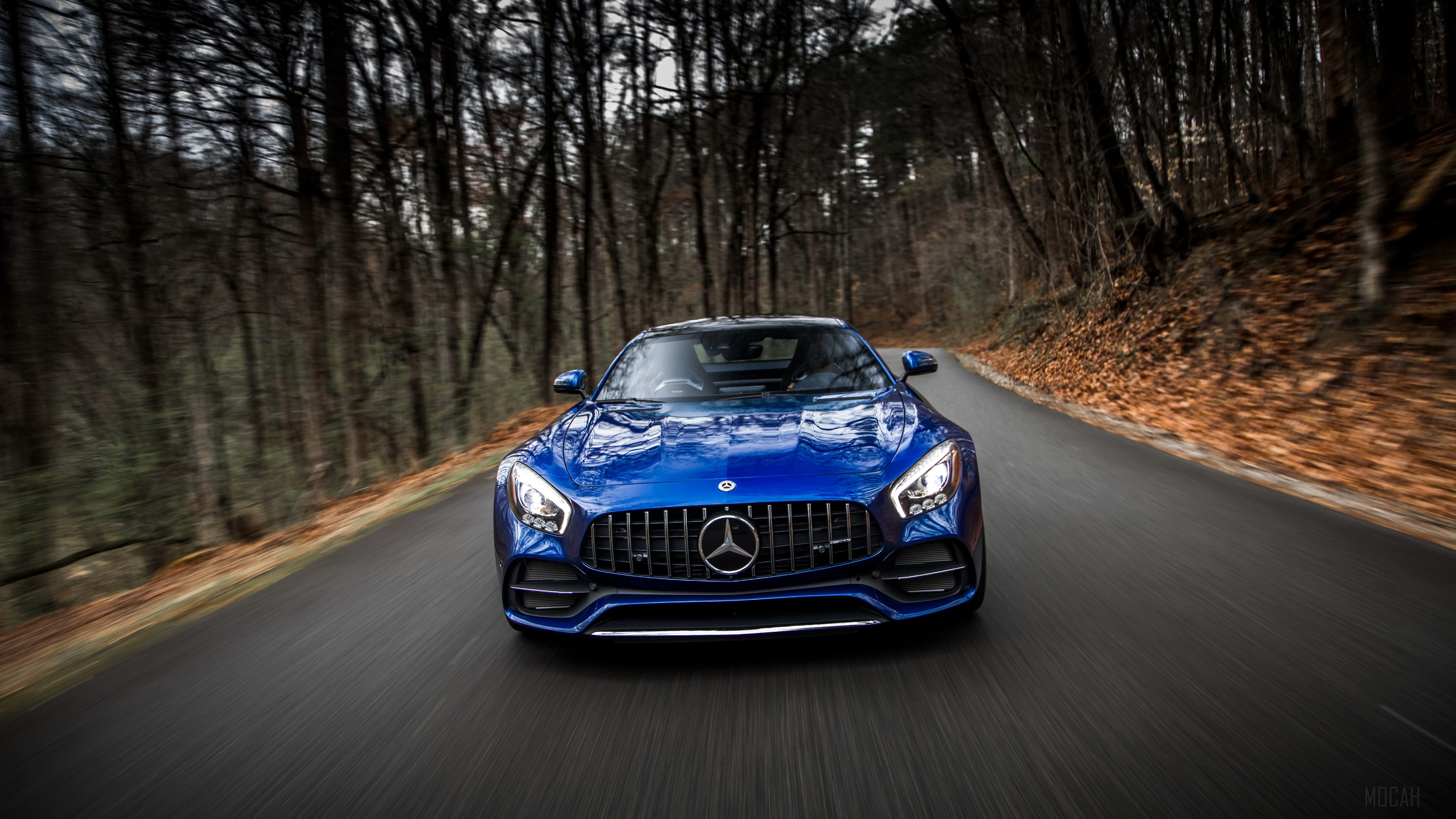 Blue 2018 Mercedes AMG GT C driving on a road HD Wallpaper