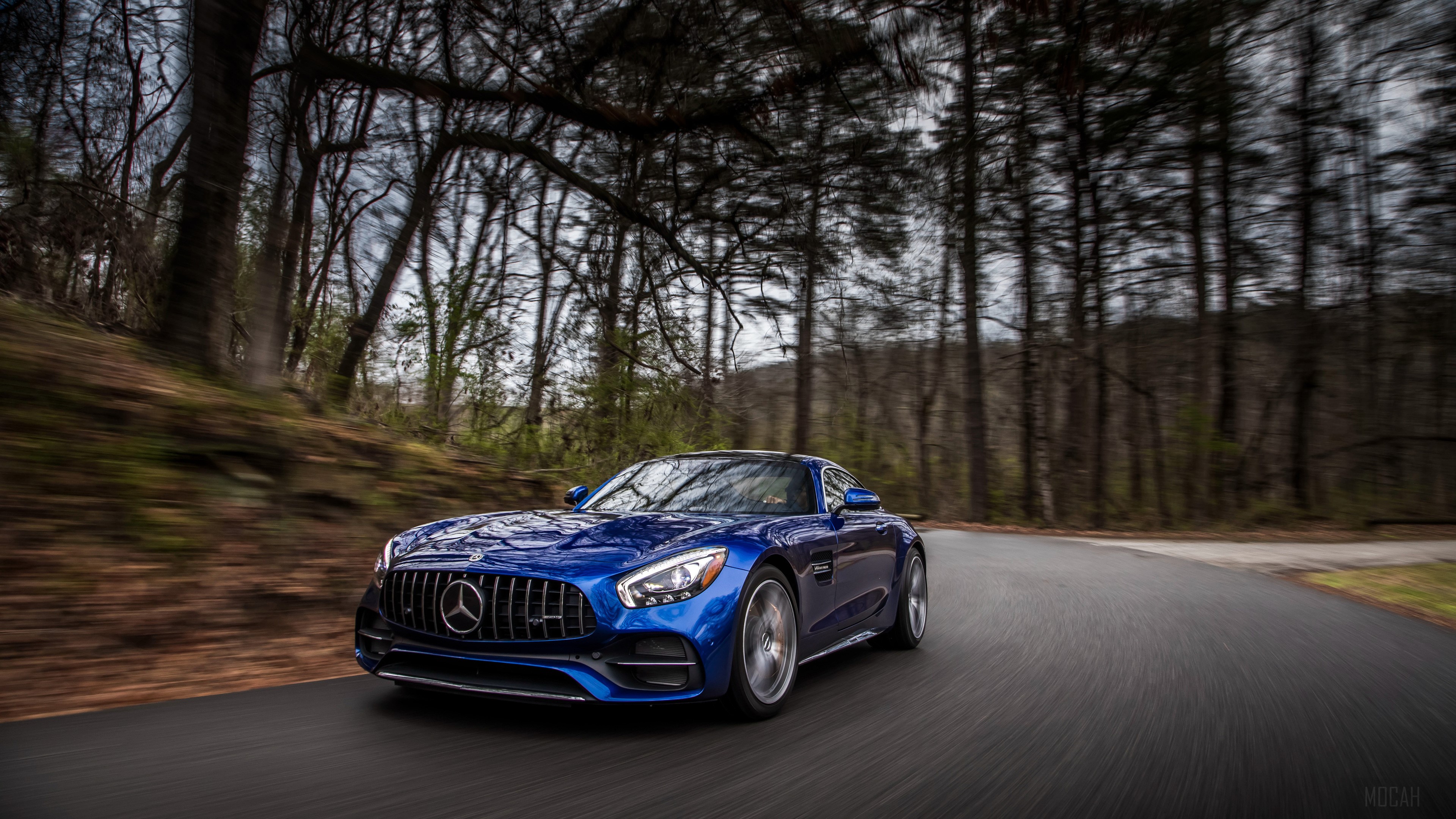 Blue 2018 Mercedes AMG GT C driving on a road HD Wallpaper