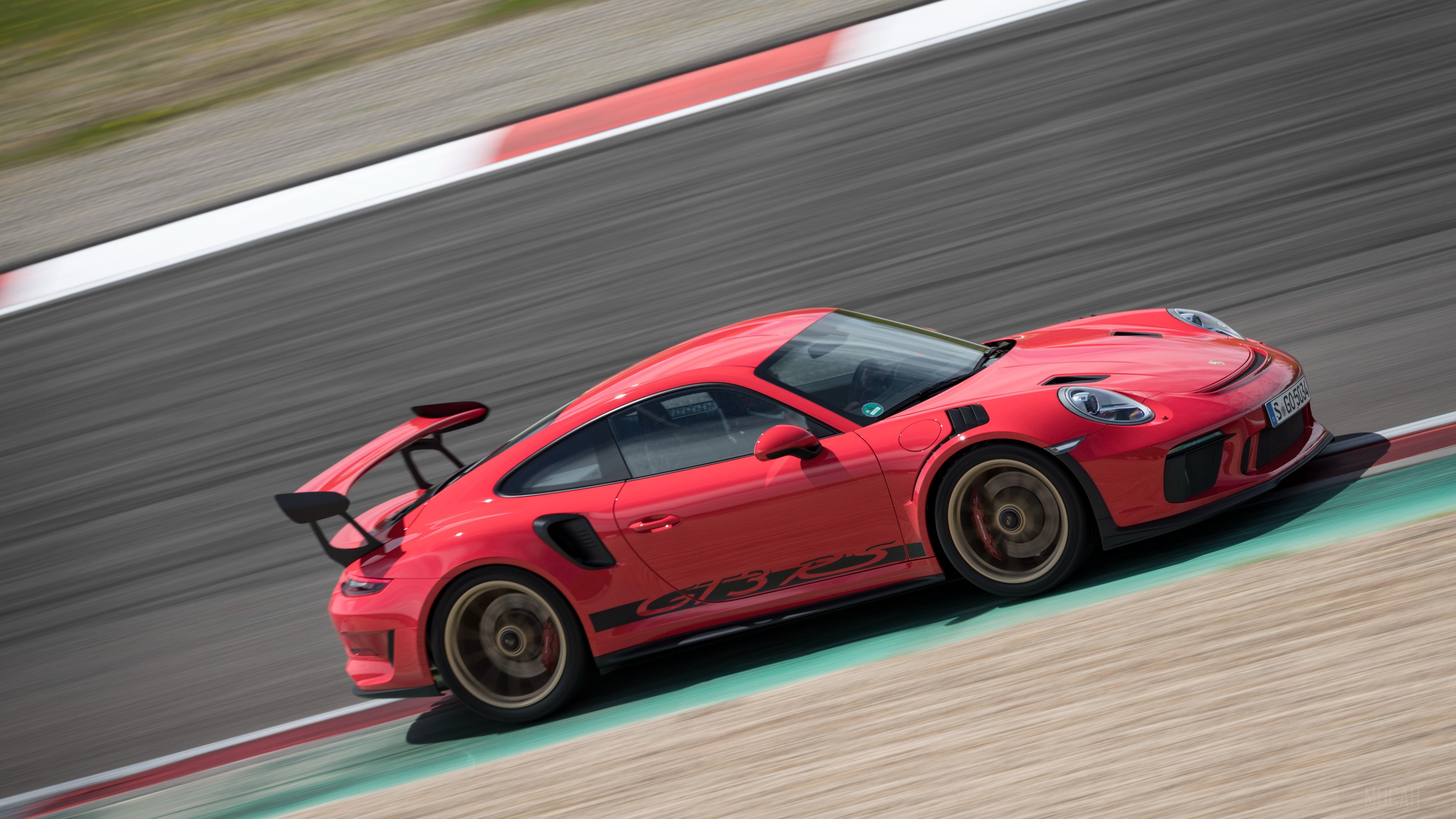 Red 2018 Porsche 911 GT3 RS on a race track HD Wallpaper