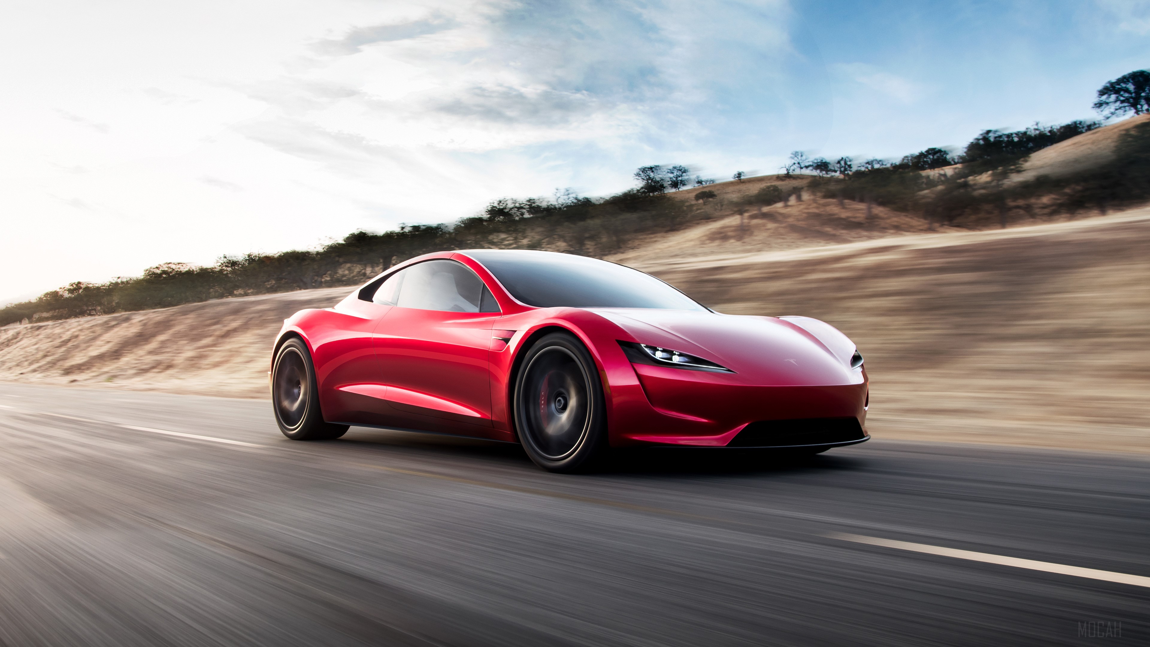 Red Tesla Roadster driving on a road HD Wallpaper