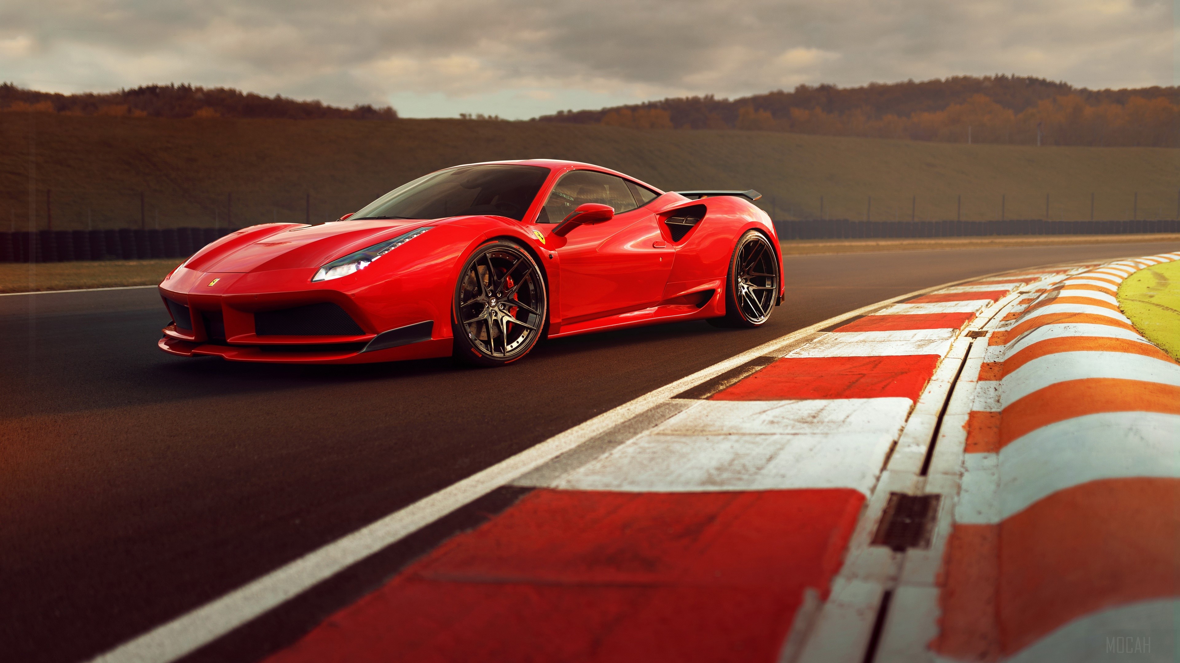 Red Ferrari 488 GTB on a race track HD Wallpaper