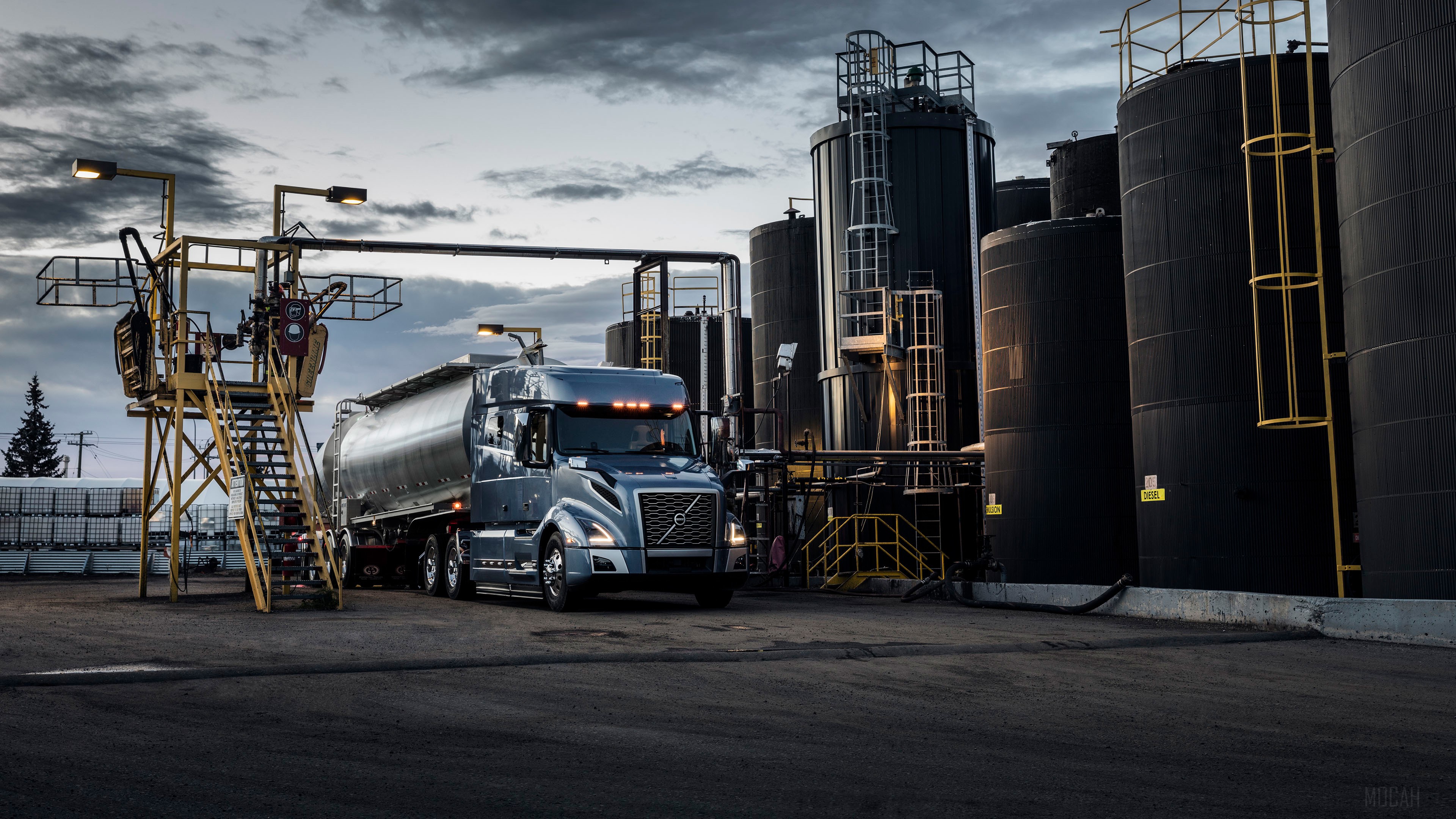 Volvo VNL 740 truck at industrial facility HD Wallpaper
