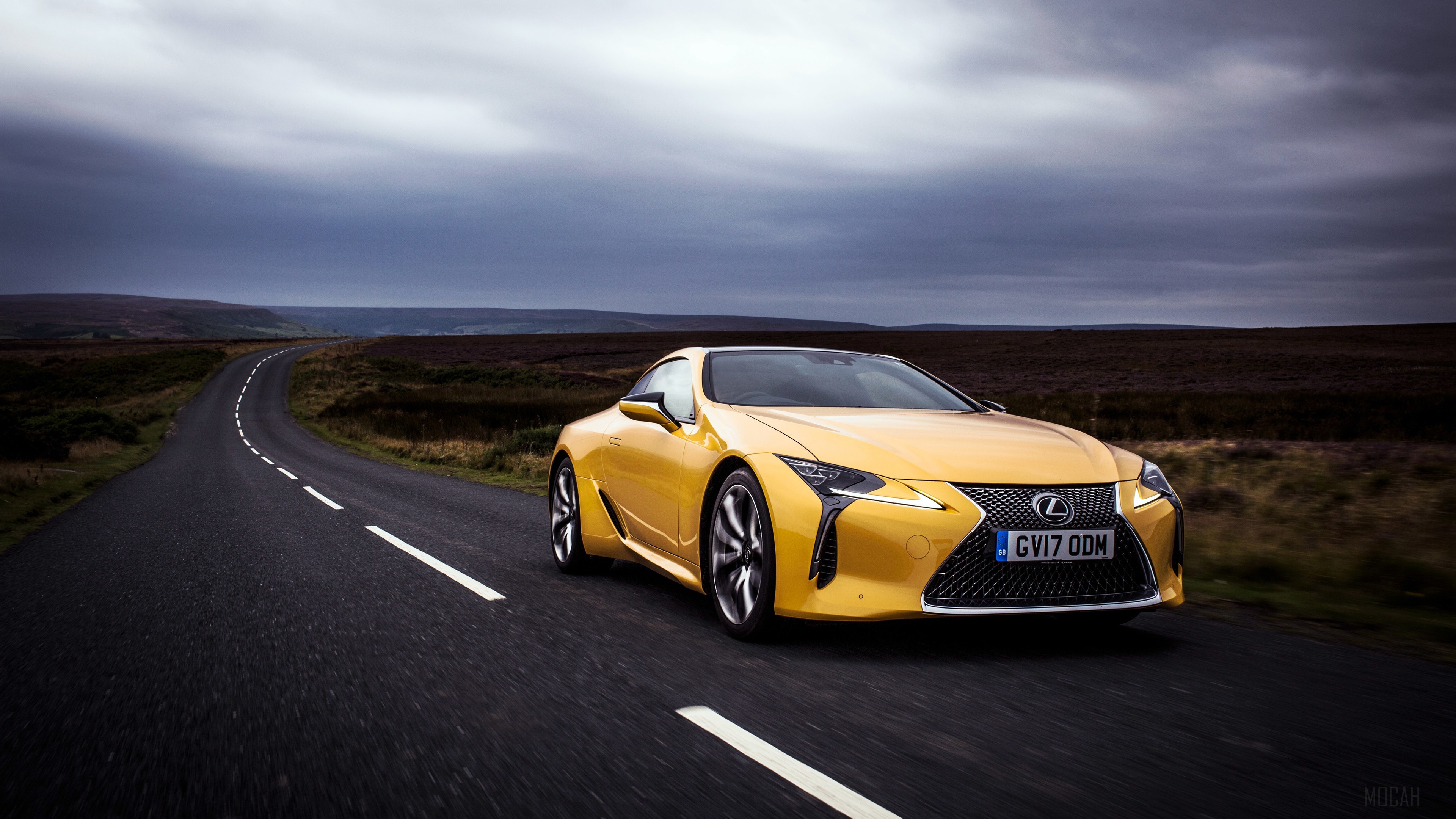Yellow 2017 Lexus LC 500 on a road HD Wallpaper