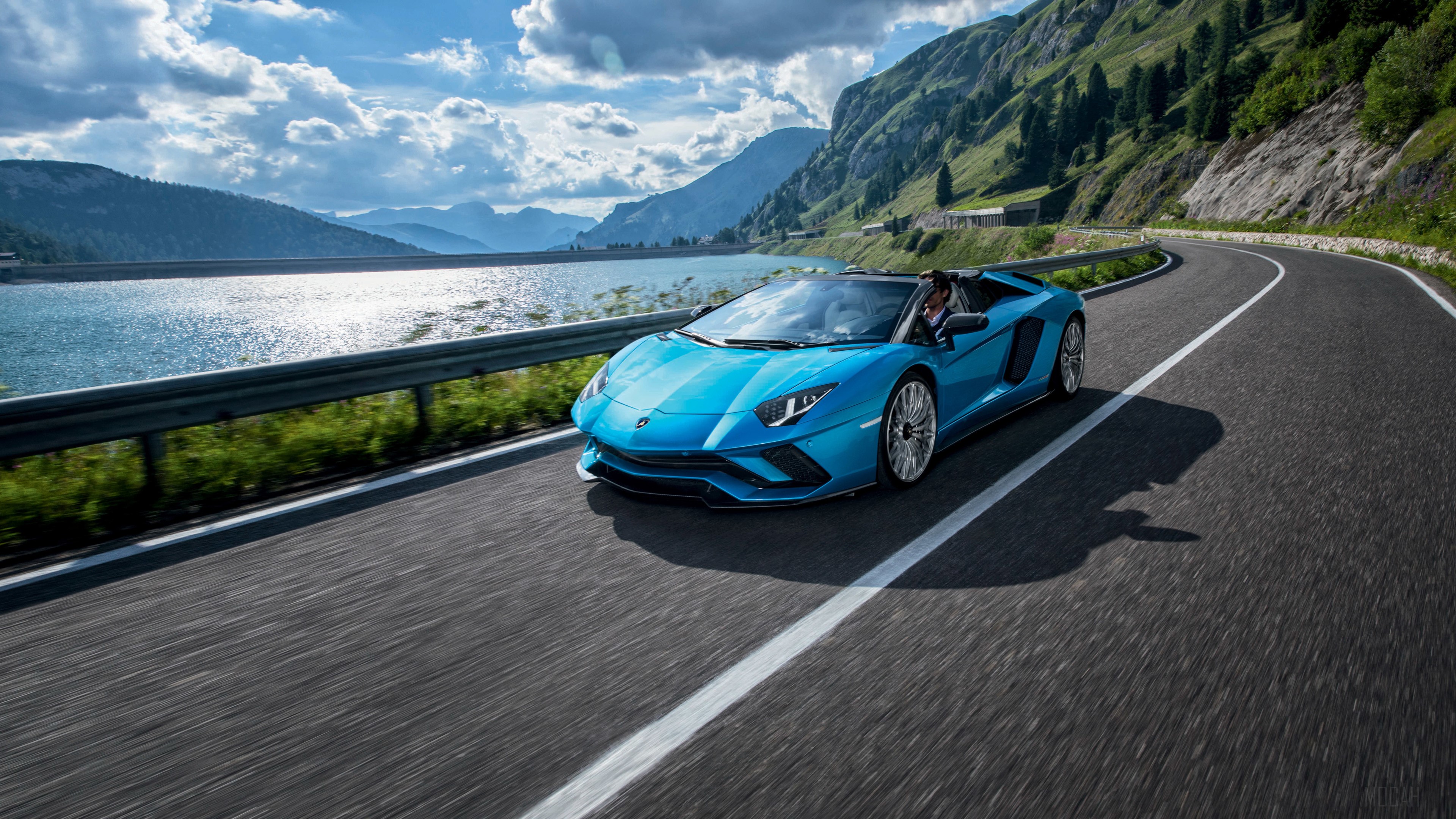 Blue Lamborghini Aventador S Roadster driving on mountain road HD Wallpaper