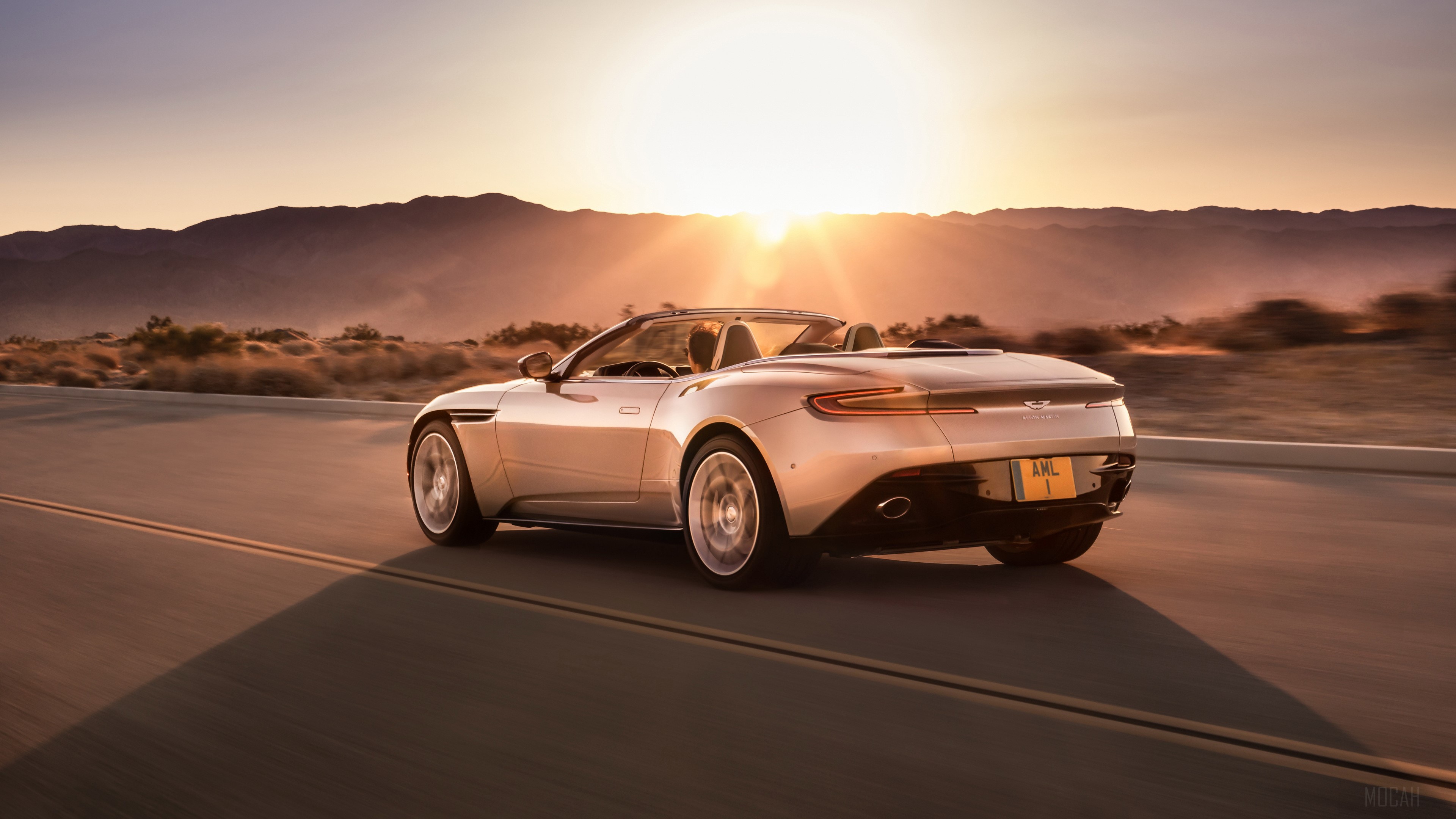 2018 Aston Martin DB11 Volante driving at sunset HD Wallpaper