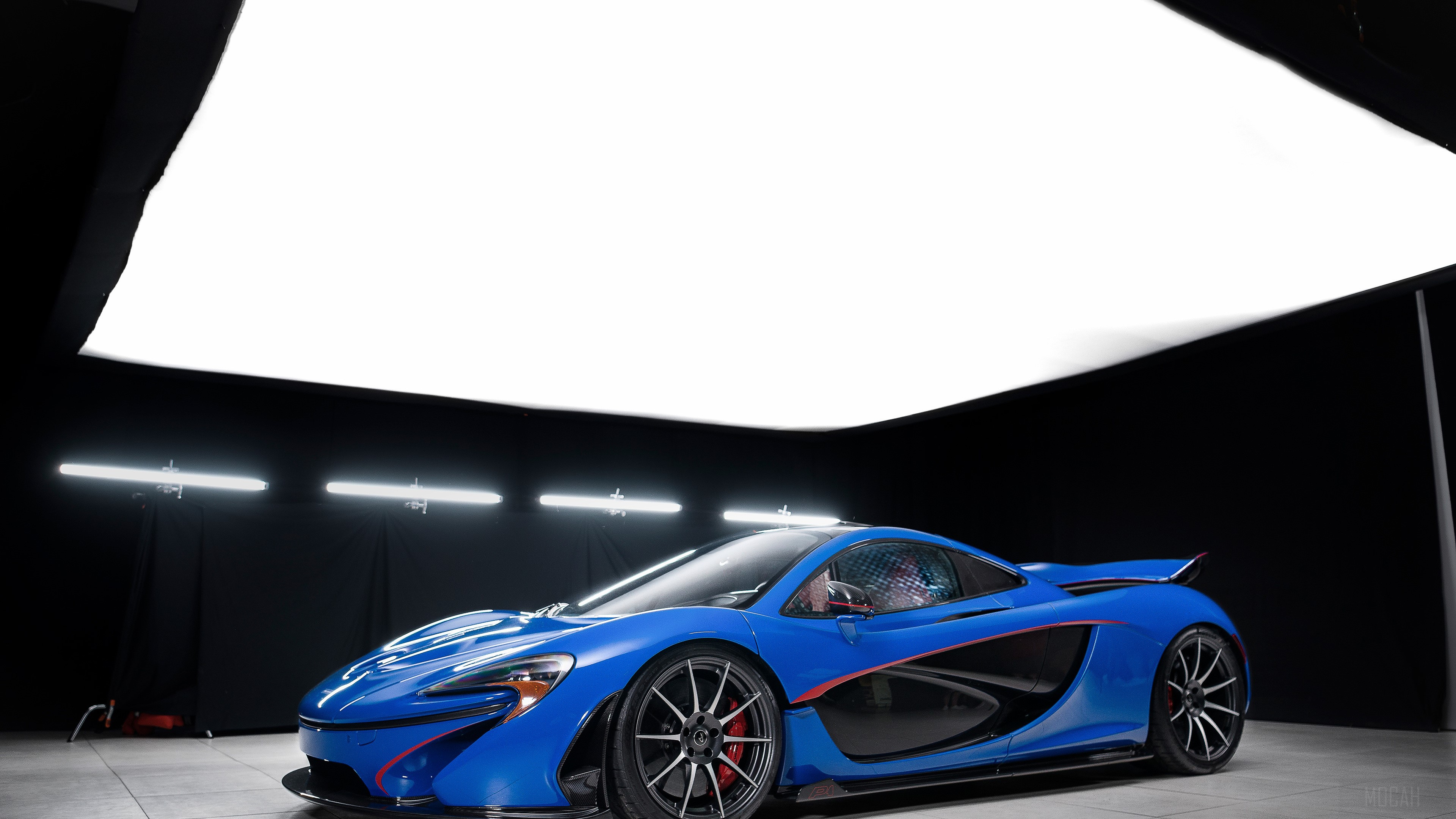 Blue McLaren P1 sports car in studio HD Wallpaper