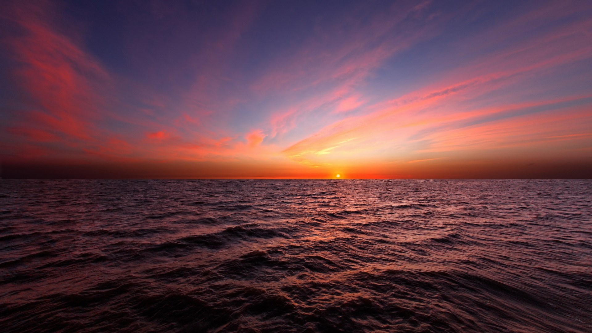 Sunset over the ocean with colorful clouds HD Wallpaper
