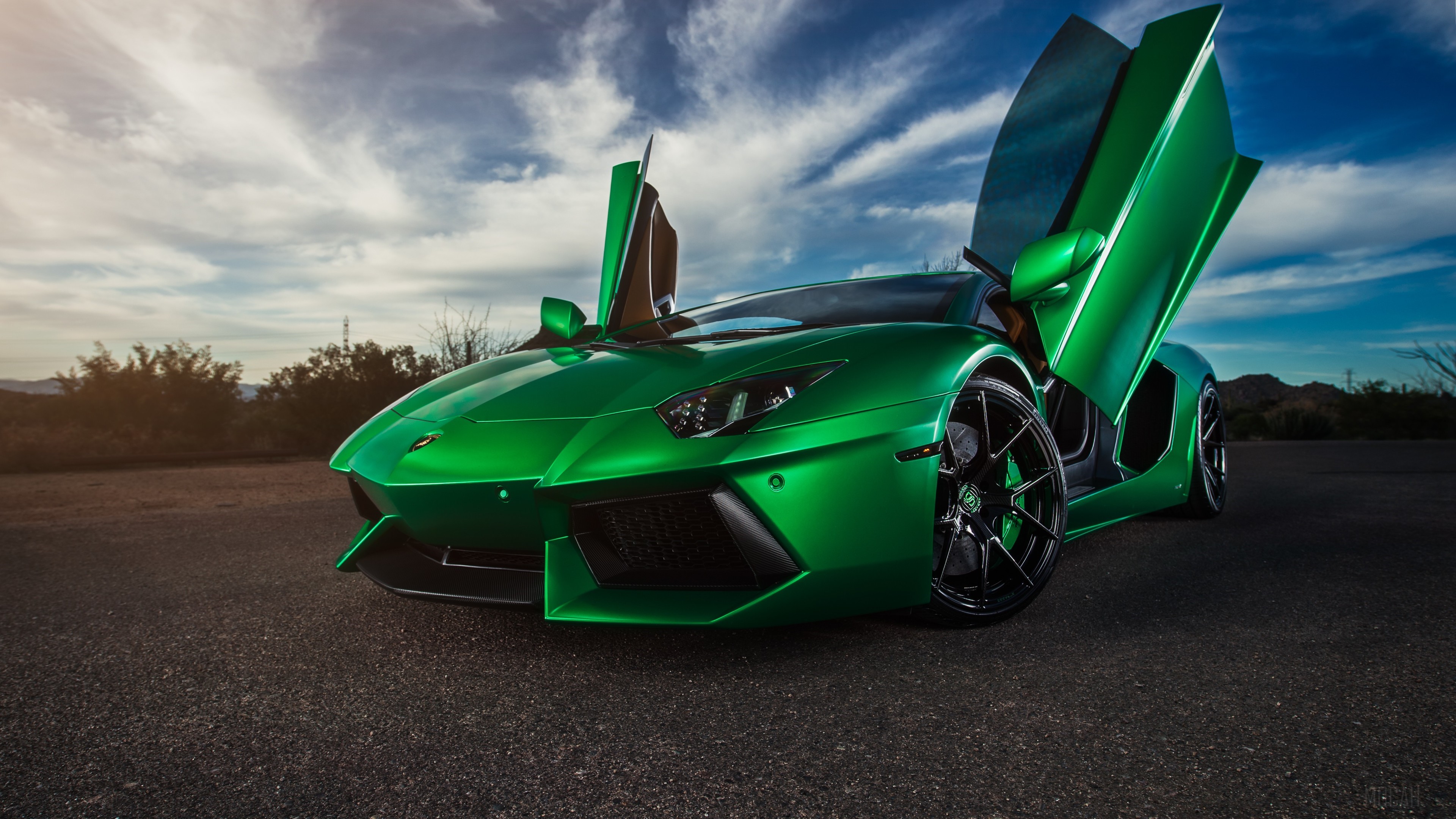 Green Lamborghini with Scissor Doors in Sunset 4K HD Wallpaper