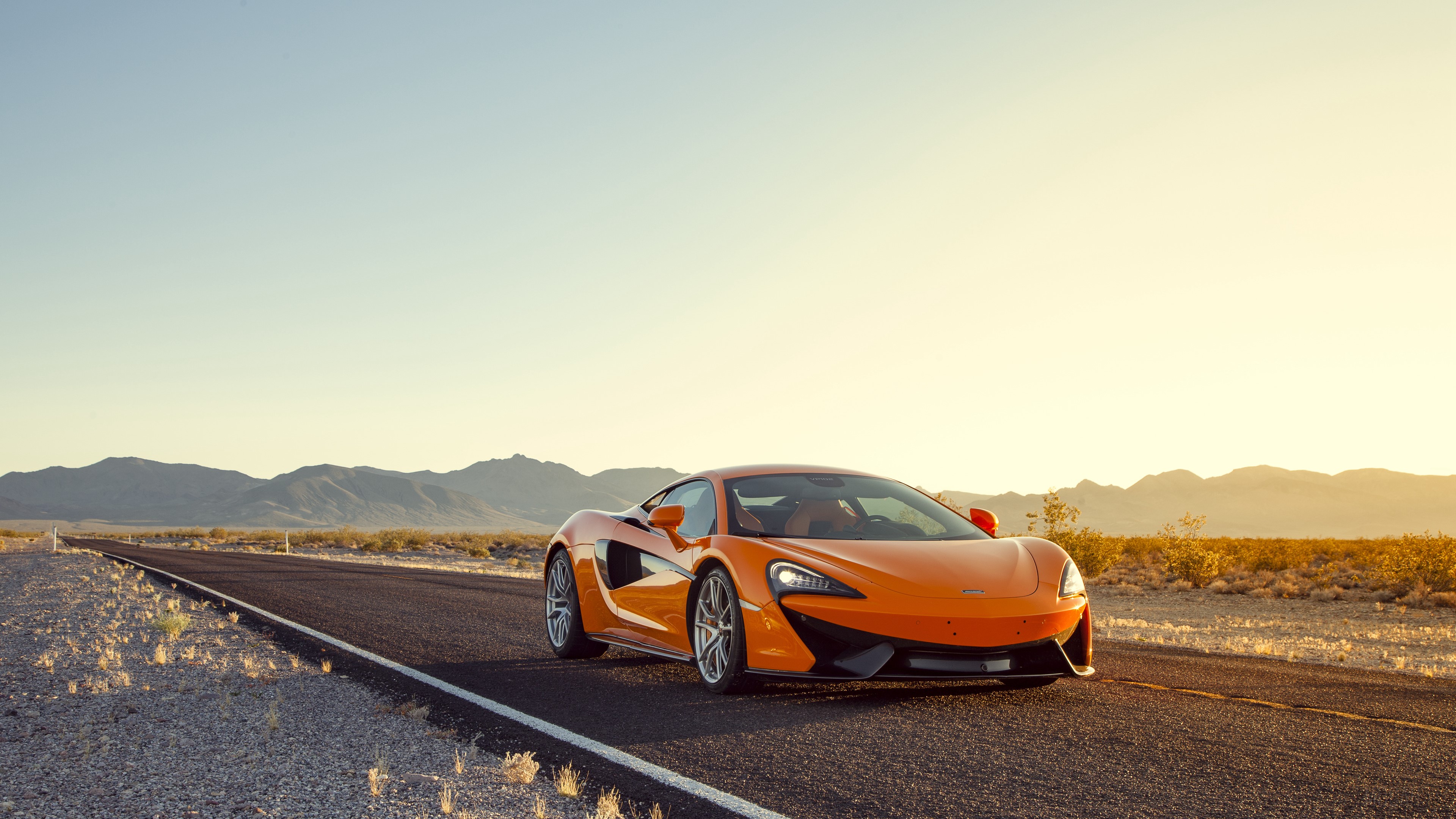 Orange McLaren 570S Sports Car on Desert Road 4K HD Wallpaper