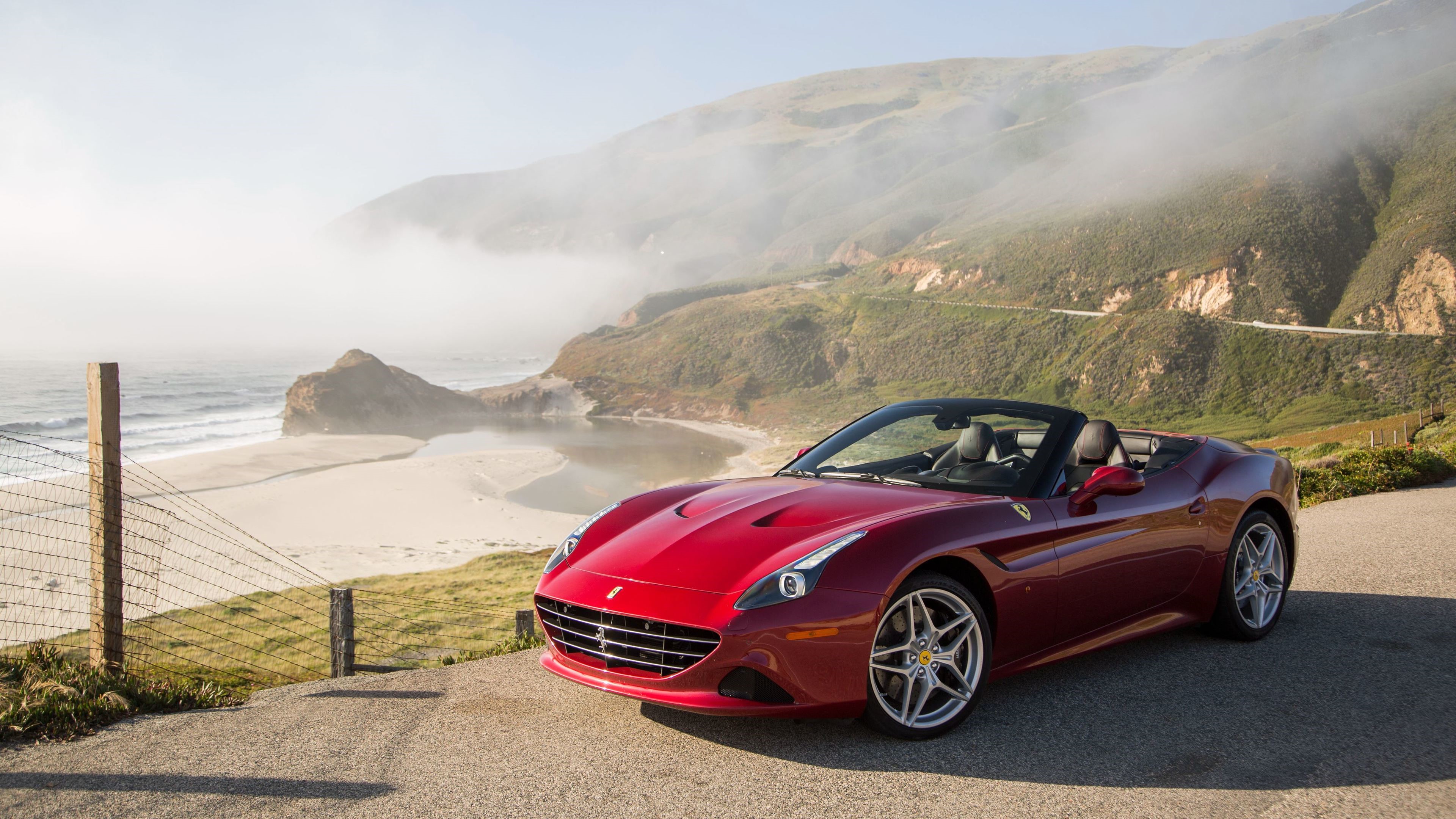 Red Ferrari California Convertible on Coastal Road HD Wallpaper