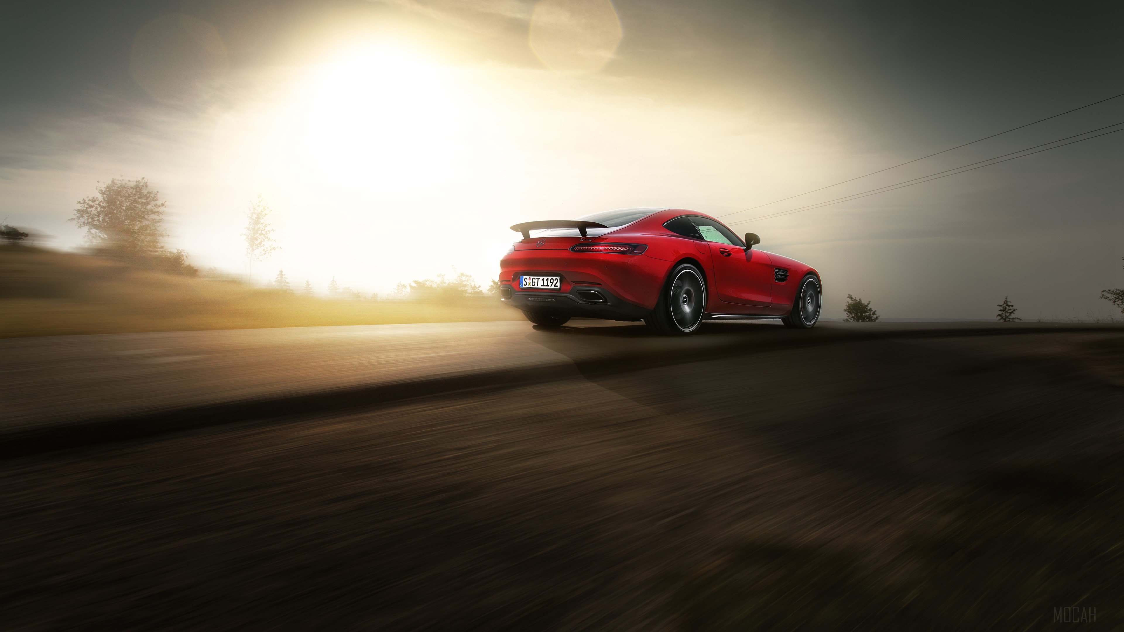 Red Mercedes AMG GTS driving on a road HD Wallpaper