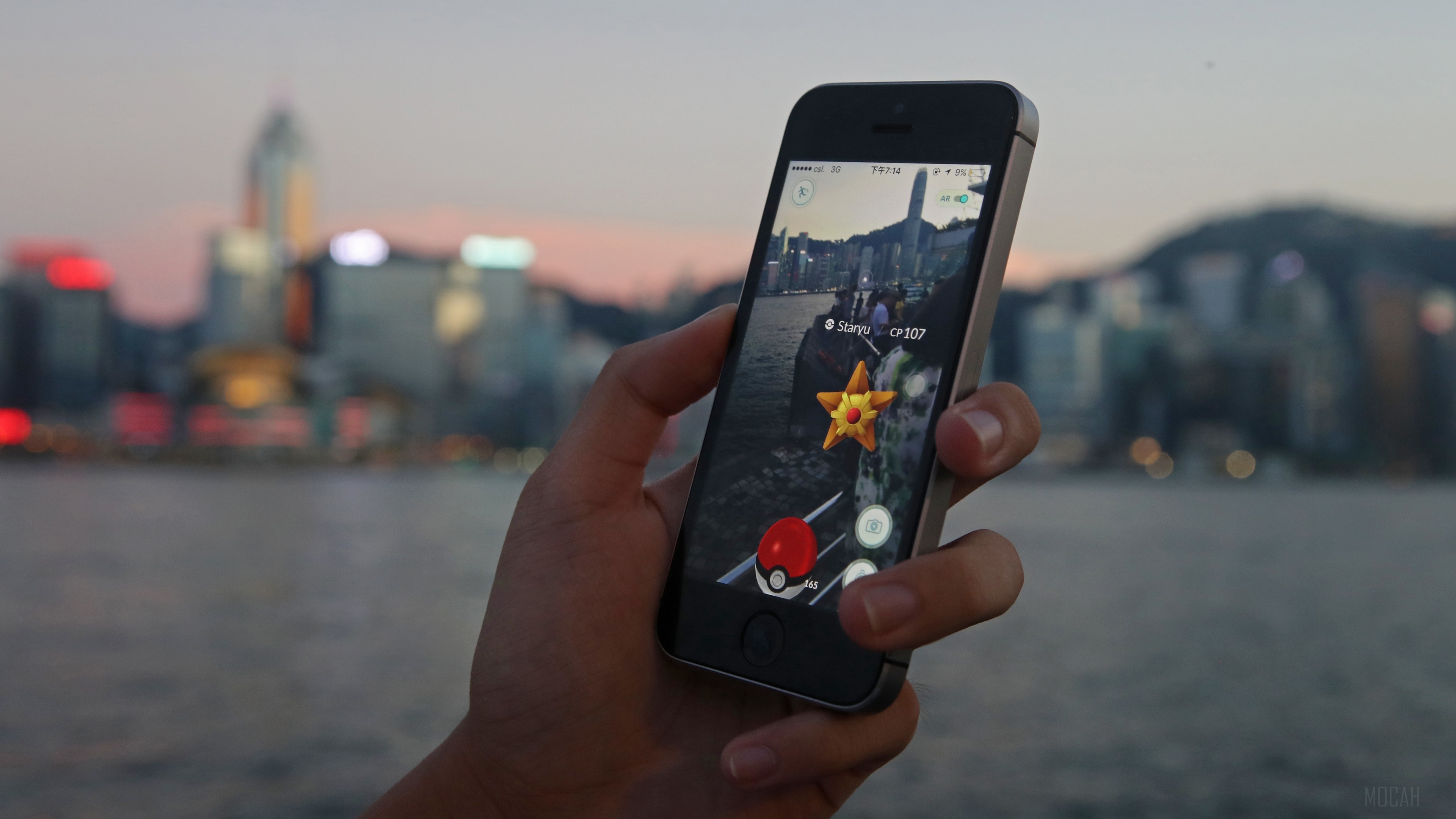 Pokemon Go on iPhone with Hong Kong skyline HD Wallpaper