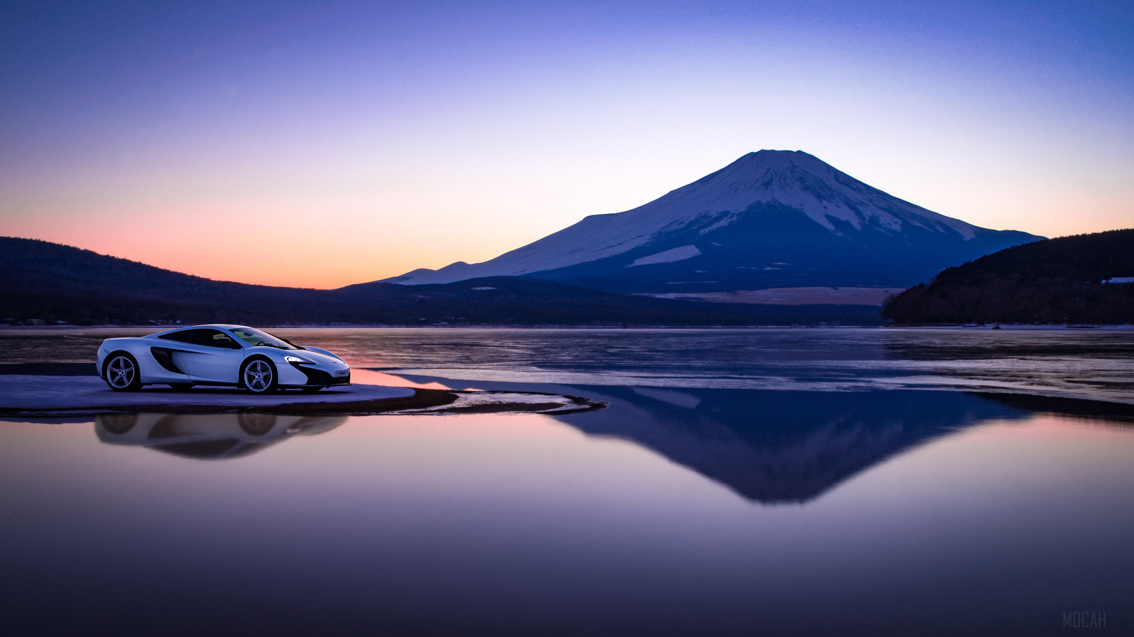 McLaren sports car by a lake with Mount Fuji at sunset HD Wallpaper