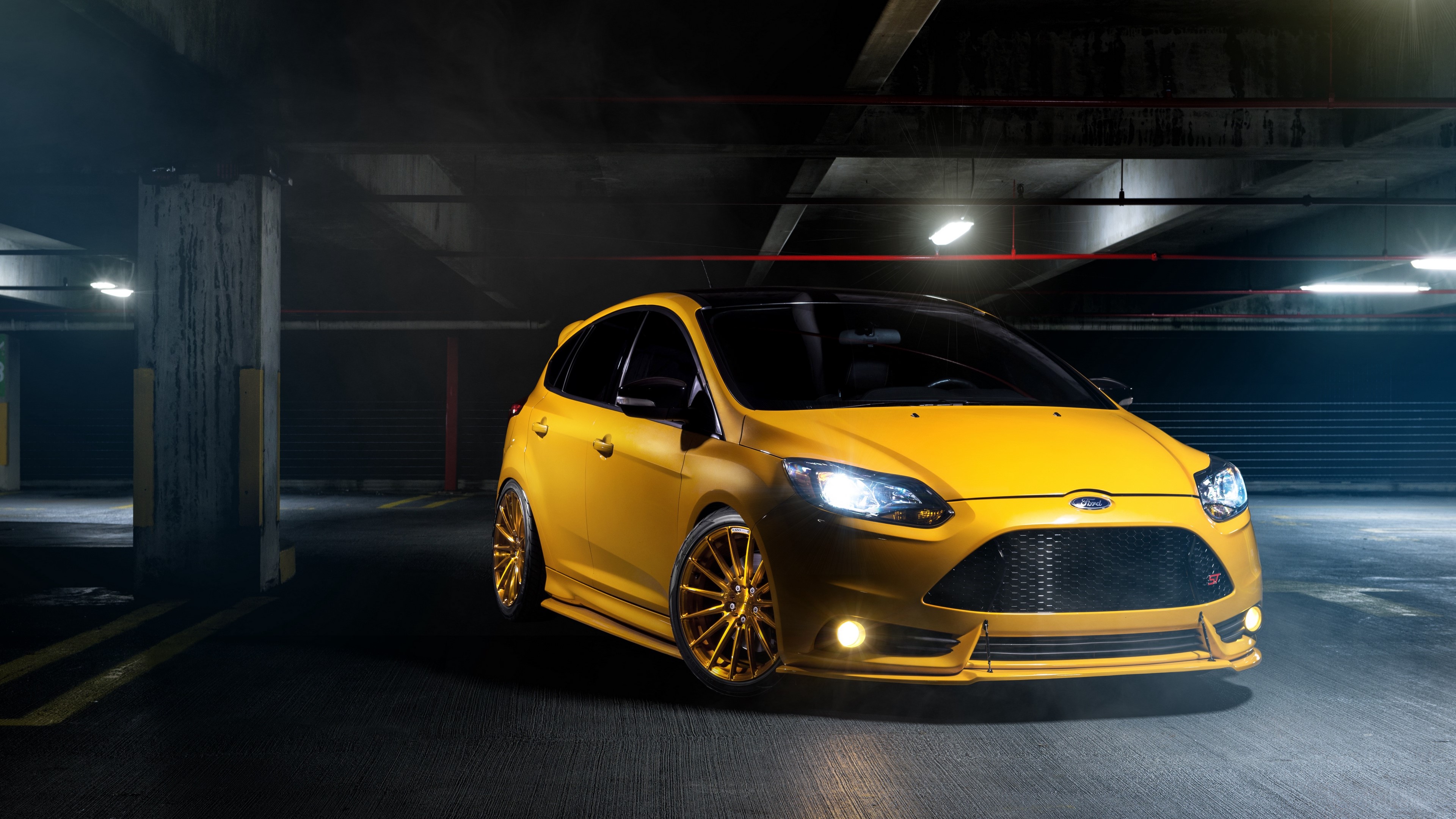 Yellow Ford Focus ST in parking garage 4K HD Wallpaper