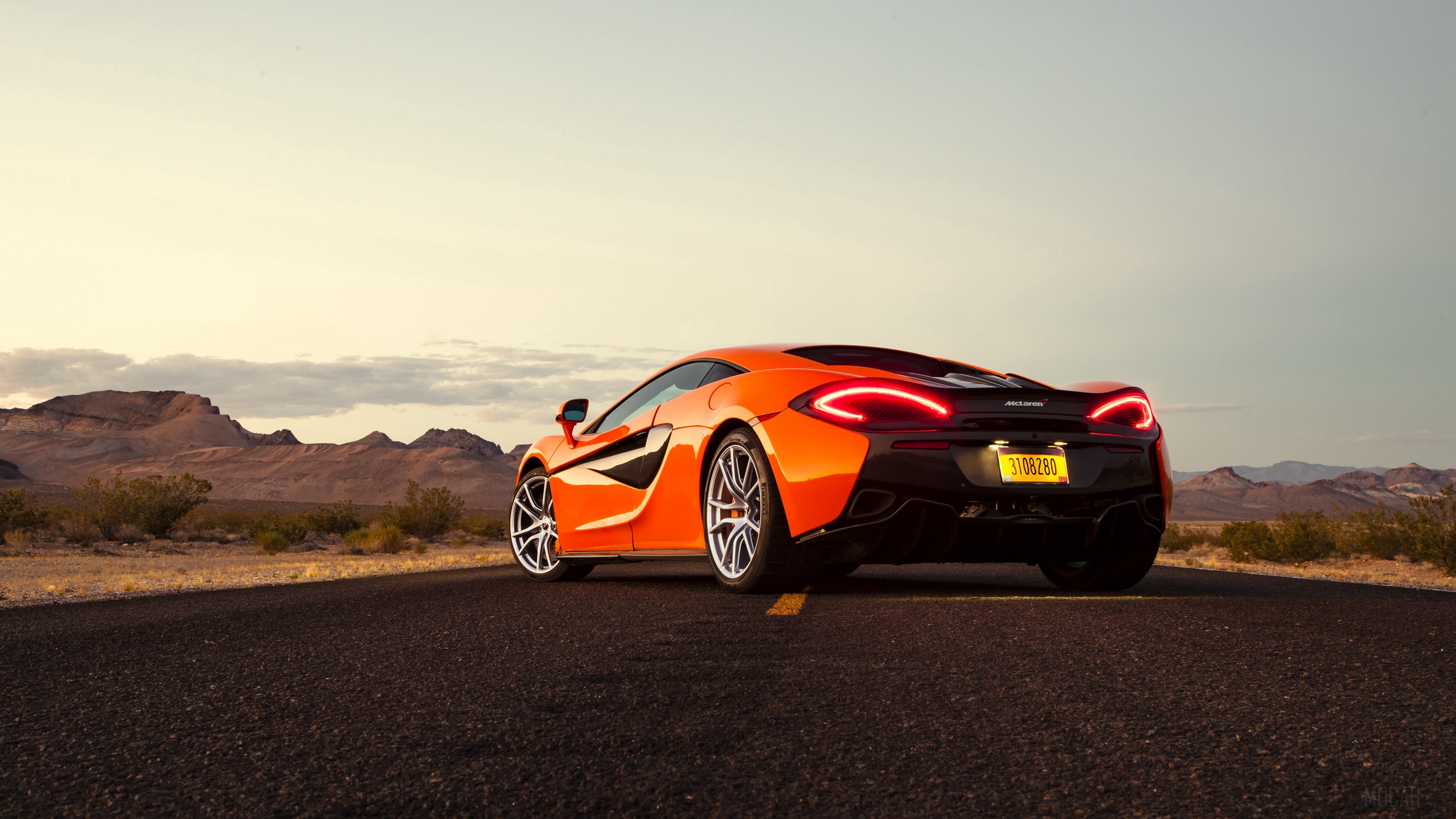 Orange McLaren 570s Sports Car on Desert Road 4K HD Wallpaper