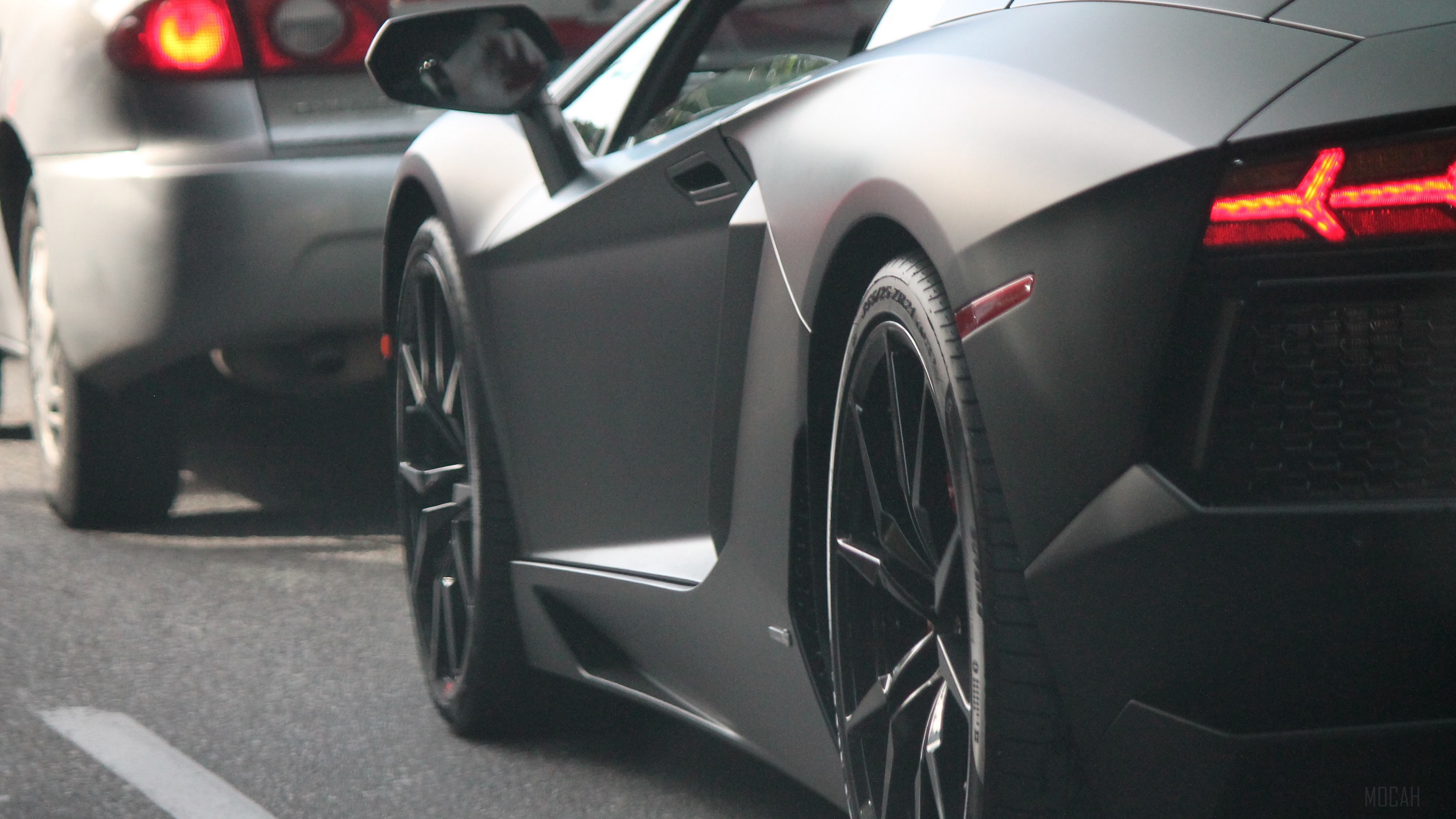Matte black Lamborghini Aventador rear view 4K HD Wallpaper