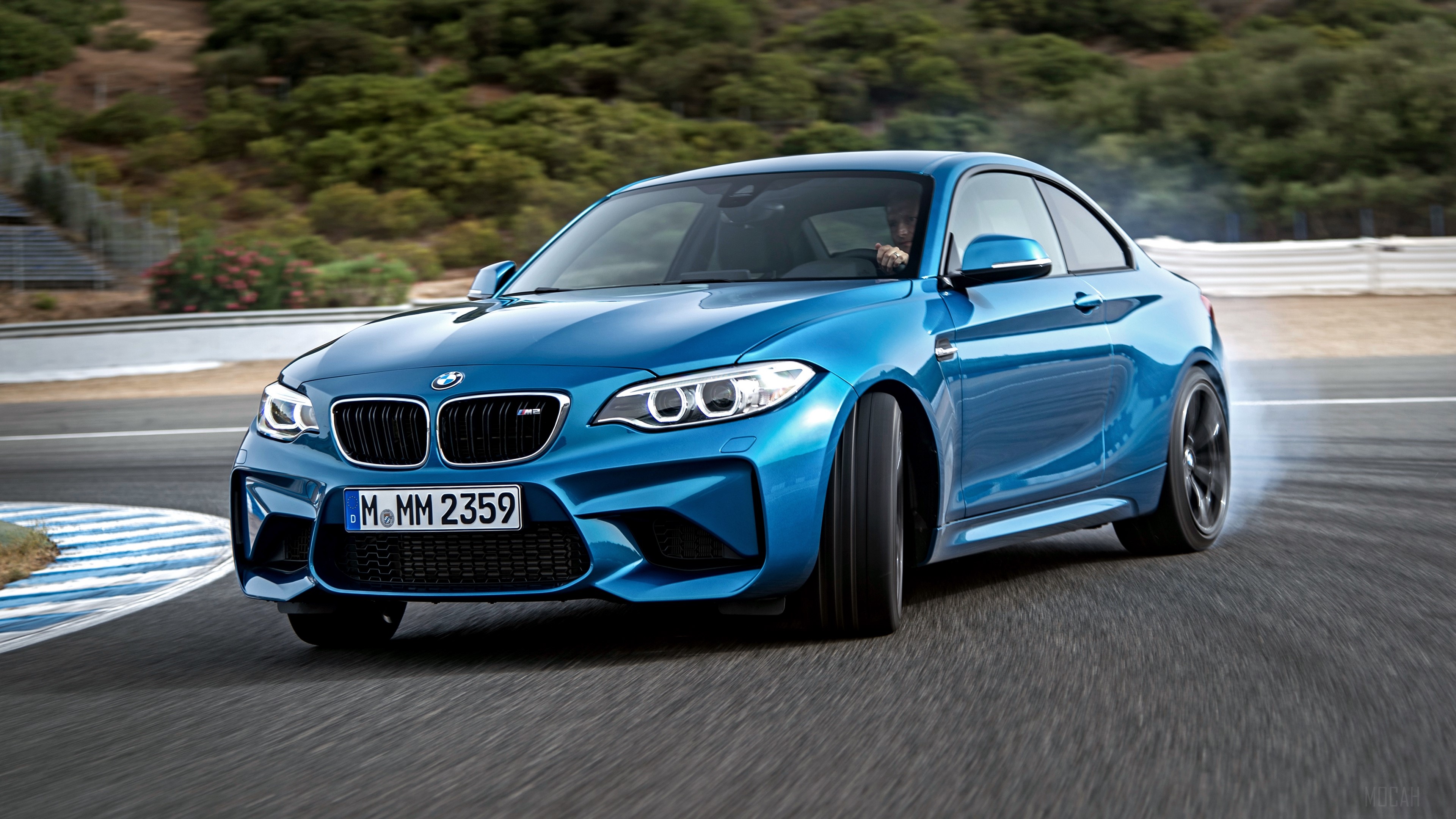 Blue BMW M2 F87 drifting on a race track 4K HD Wallpaper