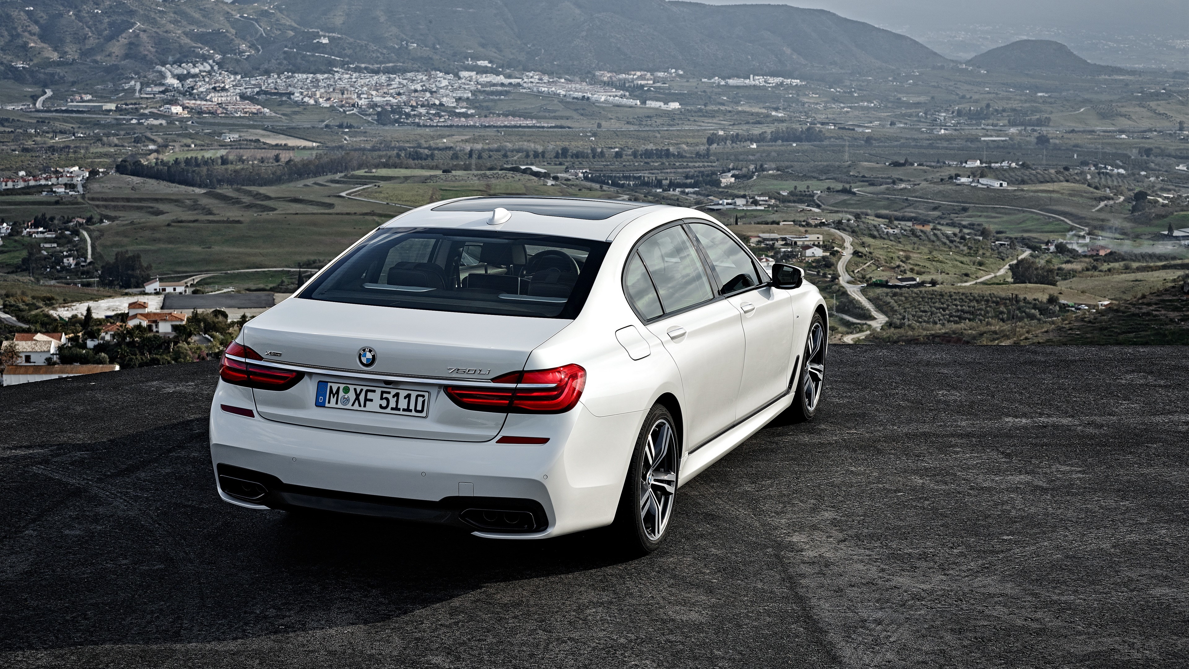 White BMW 750Li xDrive rear view 4K HD Wallpaper