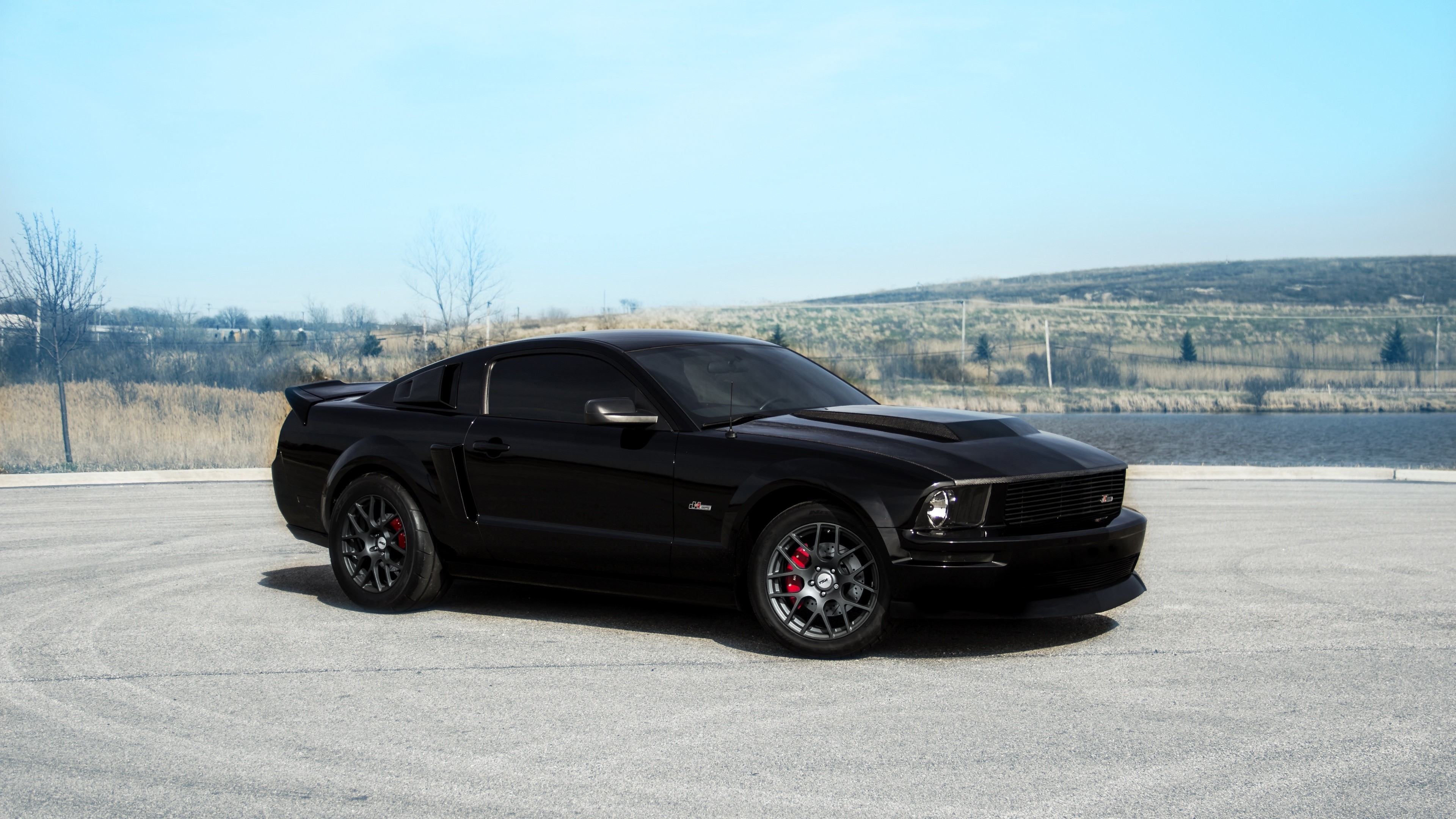 Black Ford Mustang GT with red brake calipers HD Wallpaper