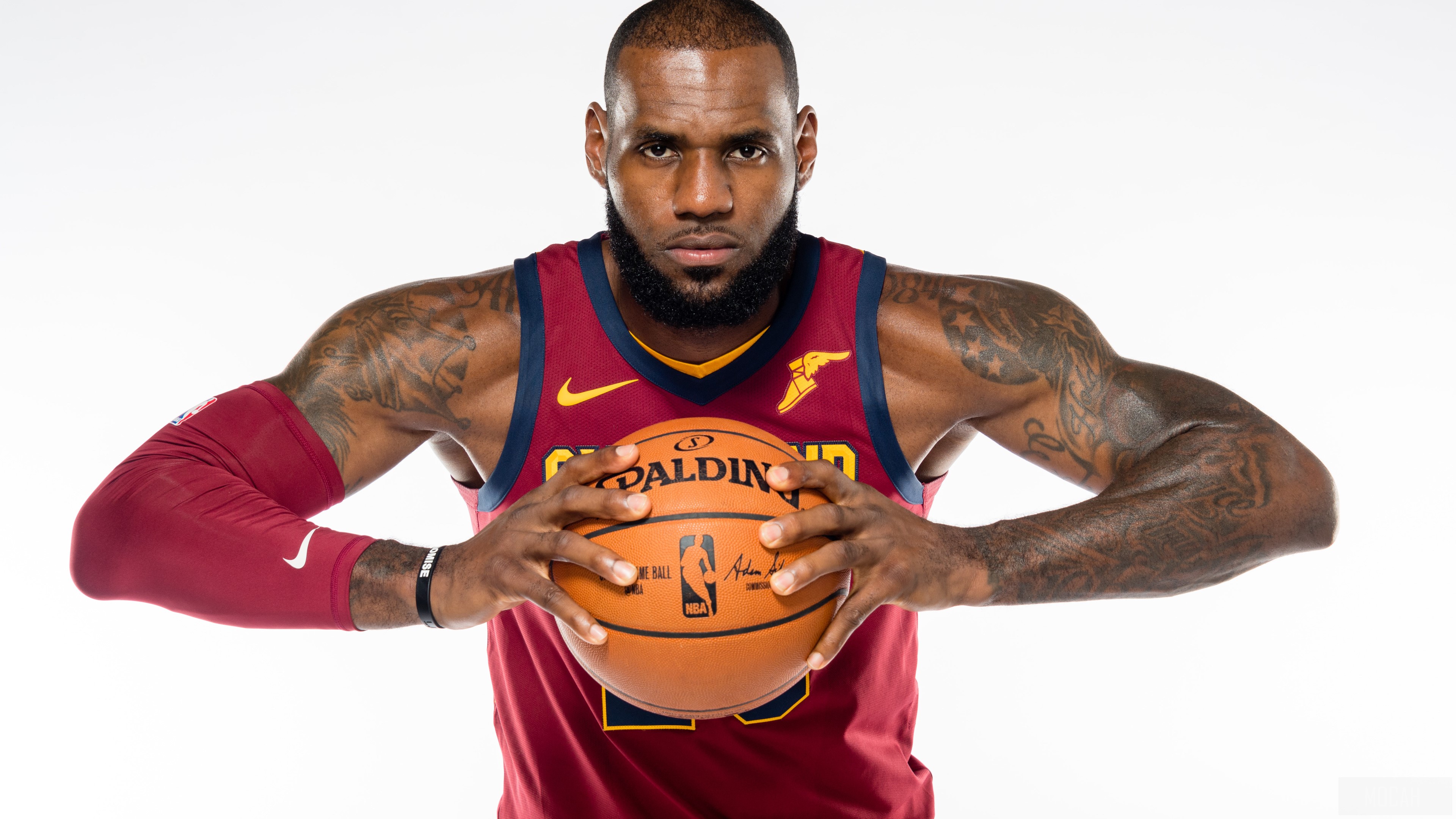 LeBron James holding a Spalding basketball HD Wallpaper