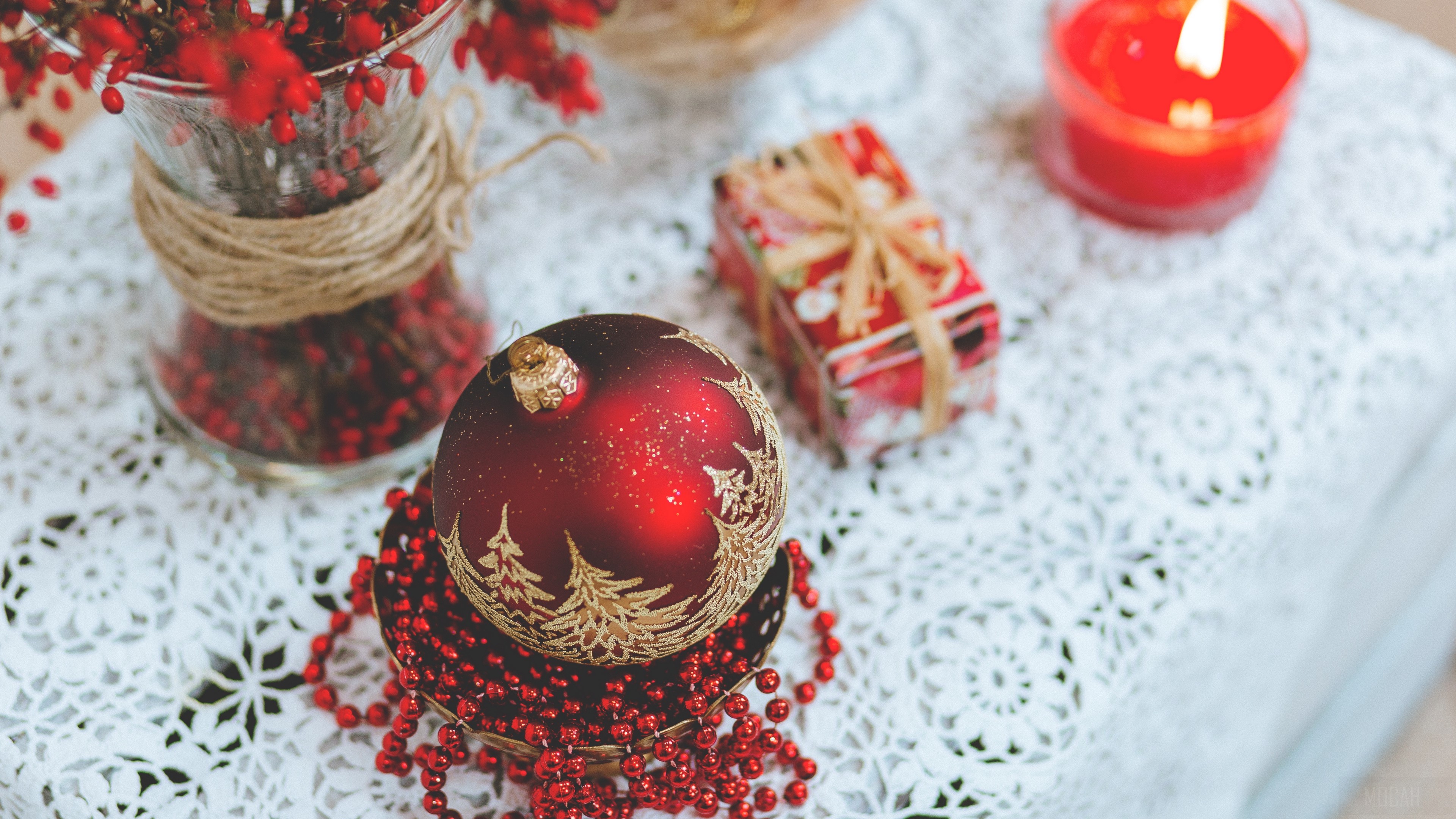 Christmas decorations with ball, candle, and gift 4K HD Wallpaper