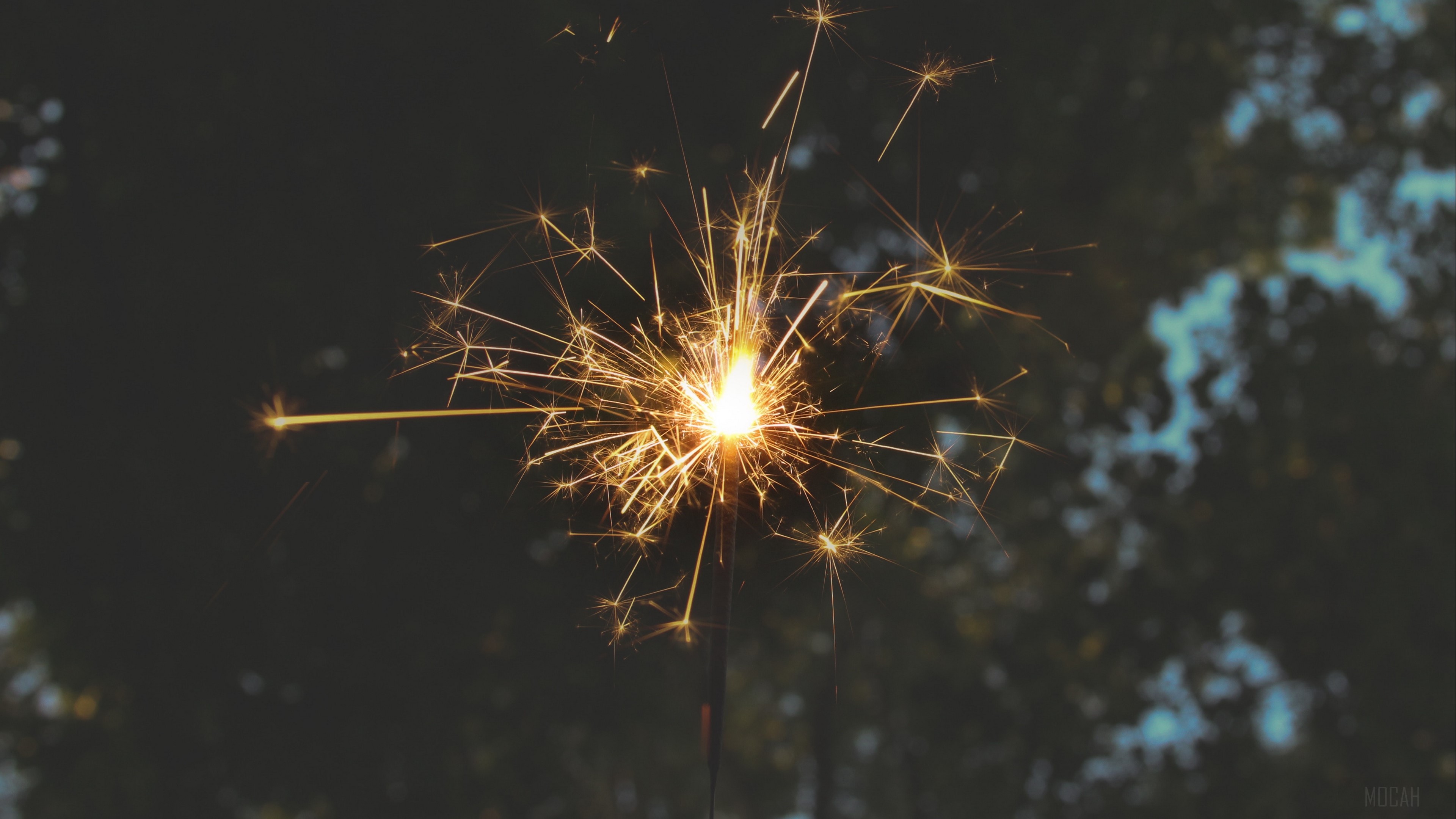 Sparkler with sparks and bokeh background HD Wallpaper
