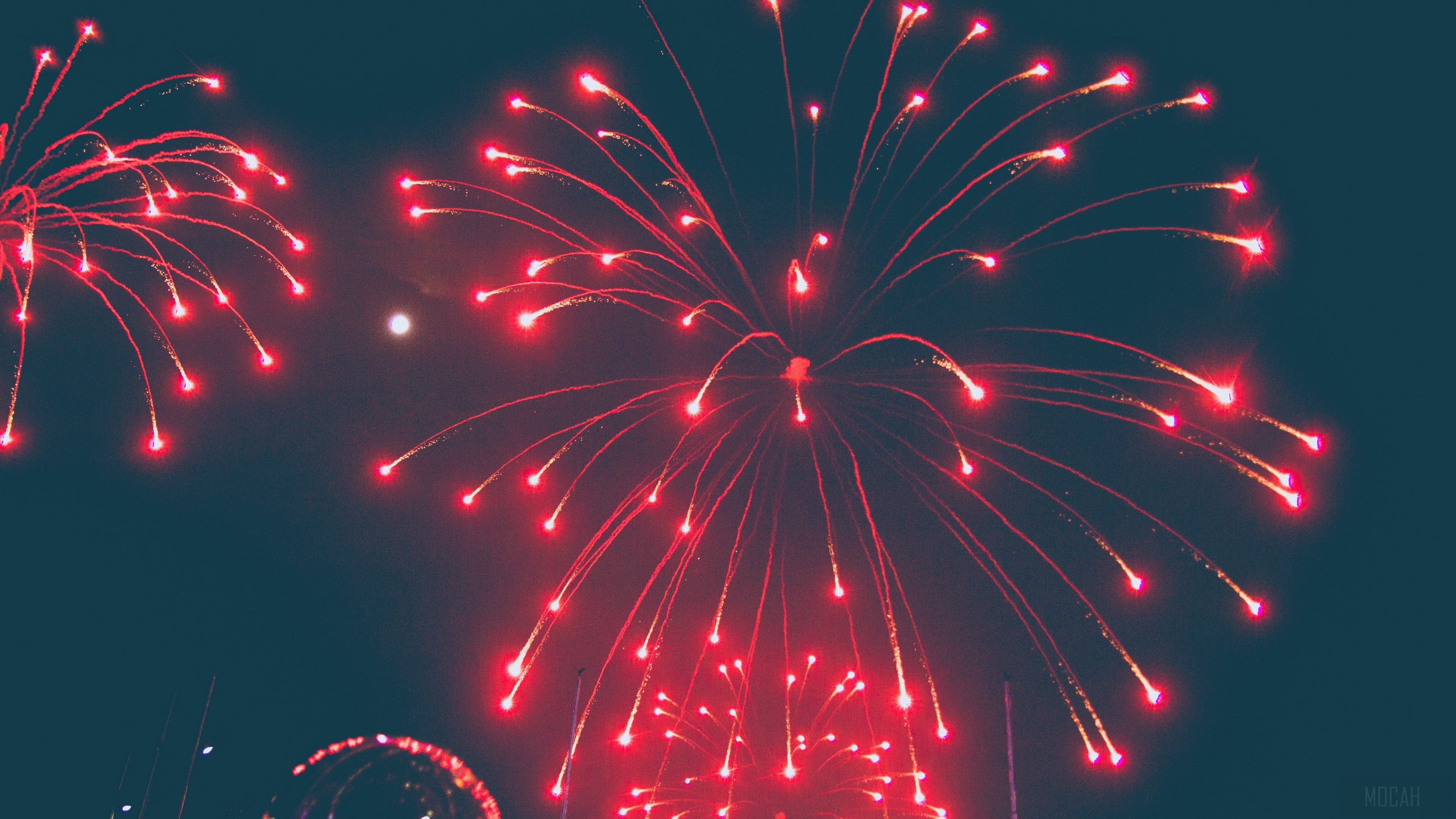 Red fireworks in the night sky HD Wallpaper