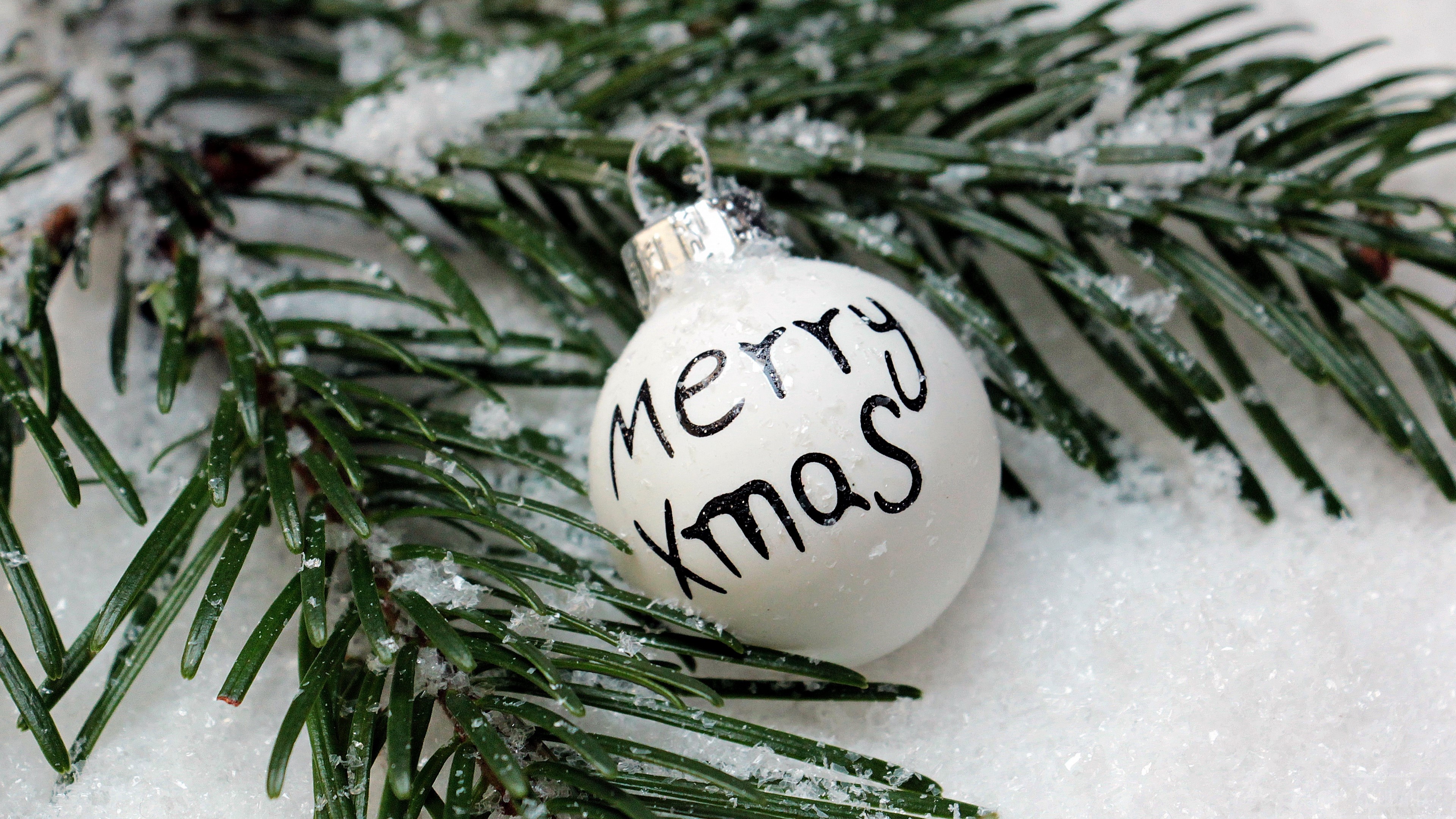 Christmas ornament with Merry Xmas text on spruce branch HD Wallpaper