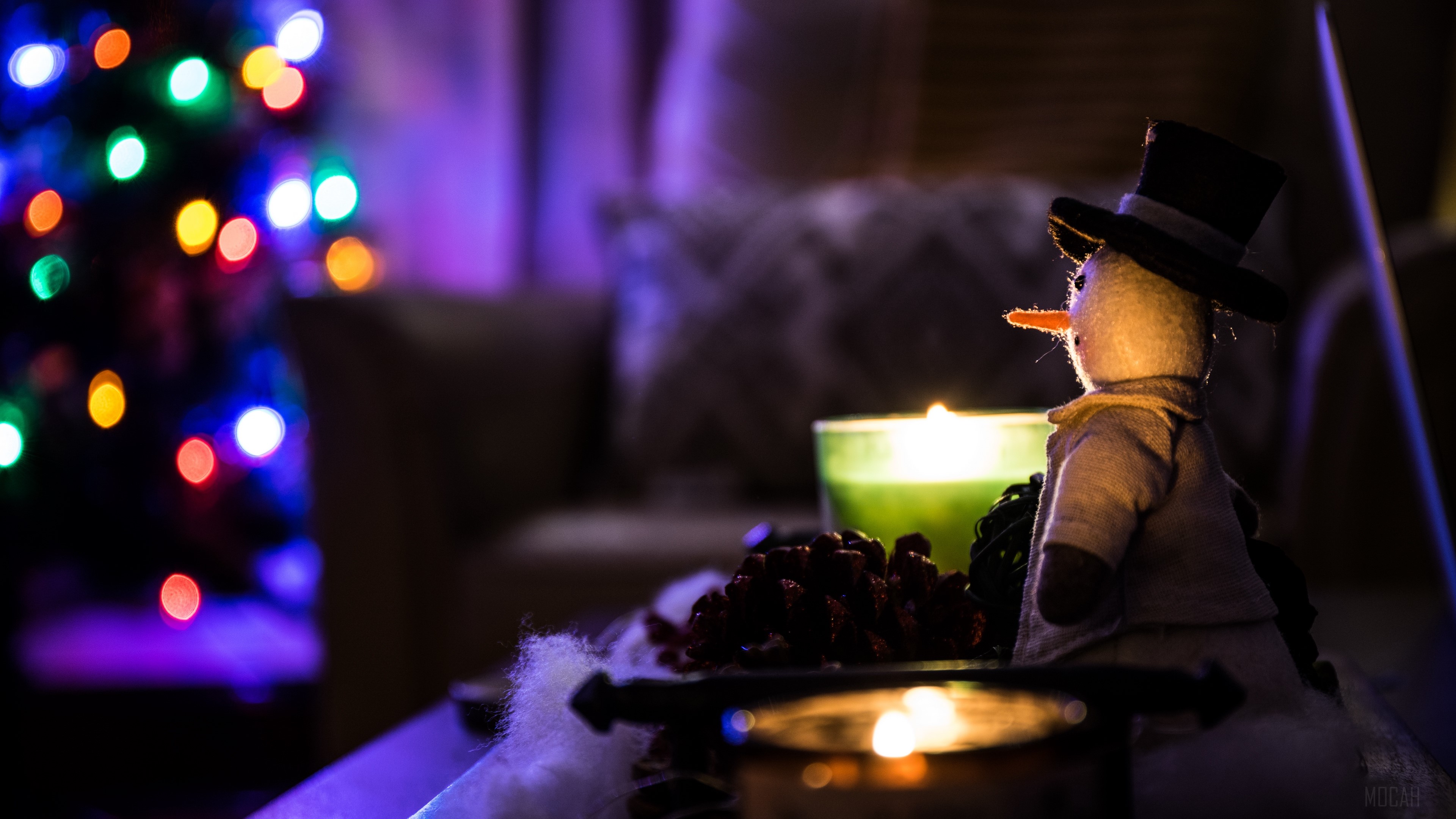 Snowman with Christmas lights and candles 4K HD Wallpaper