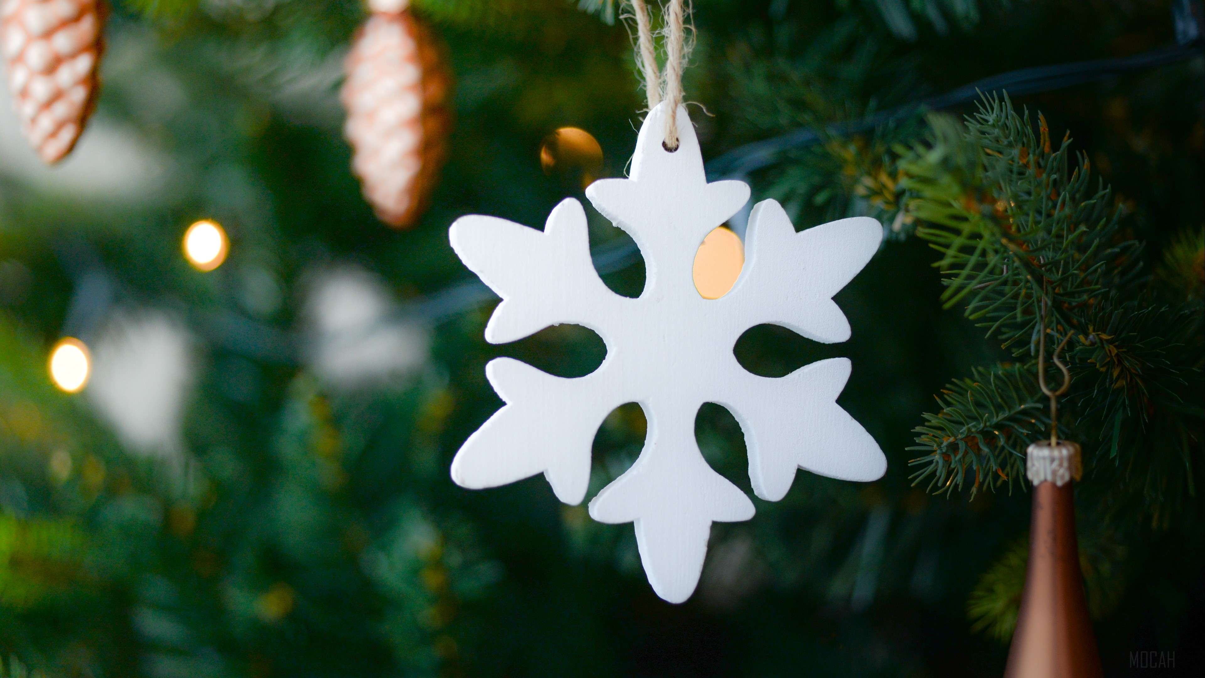 White snowflake decoration on a Christmas tree 4K HD Wallpaper