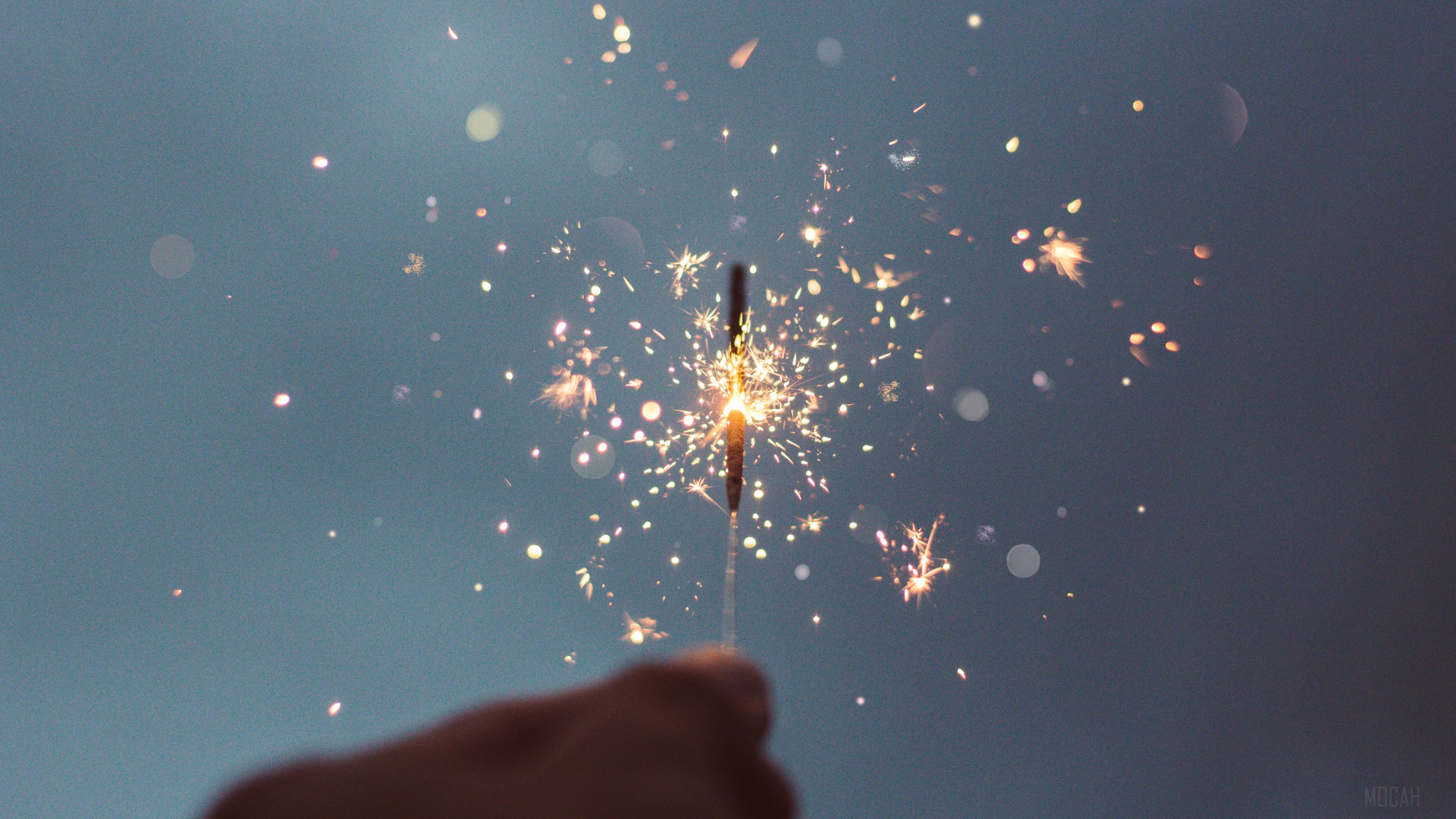 Sparkler with sparks and bokeh 4K HD Wallpaper