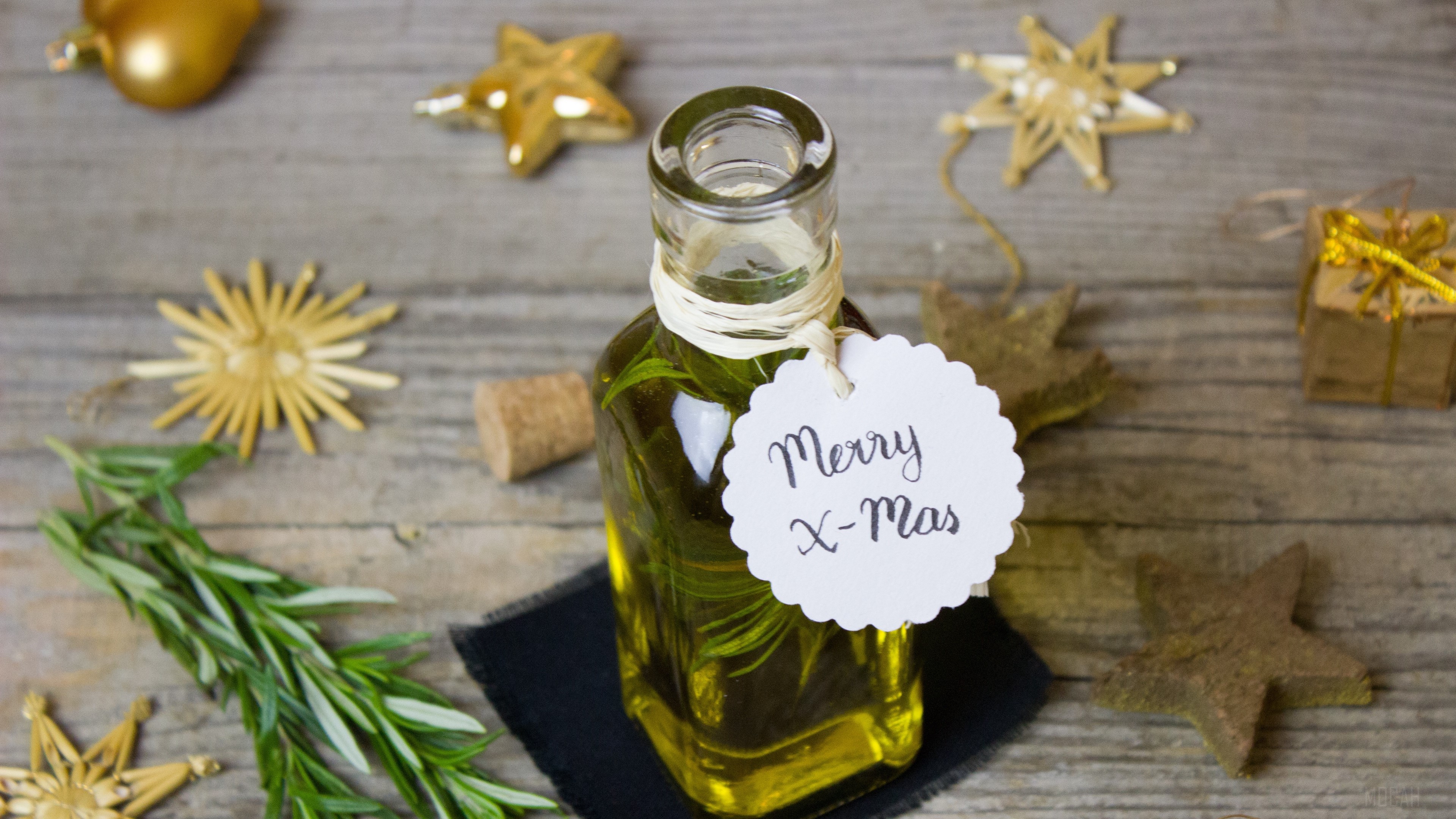 Rosemary infused olive oil with Christmas decorations HD Wallpaper