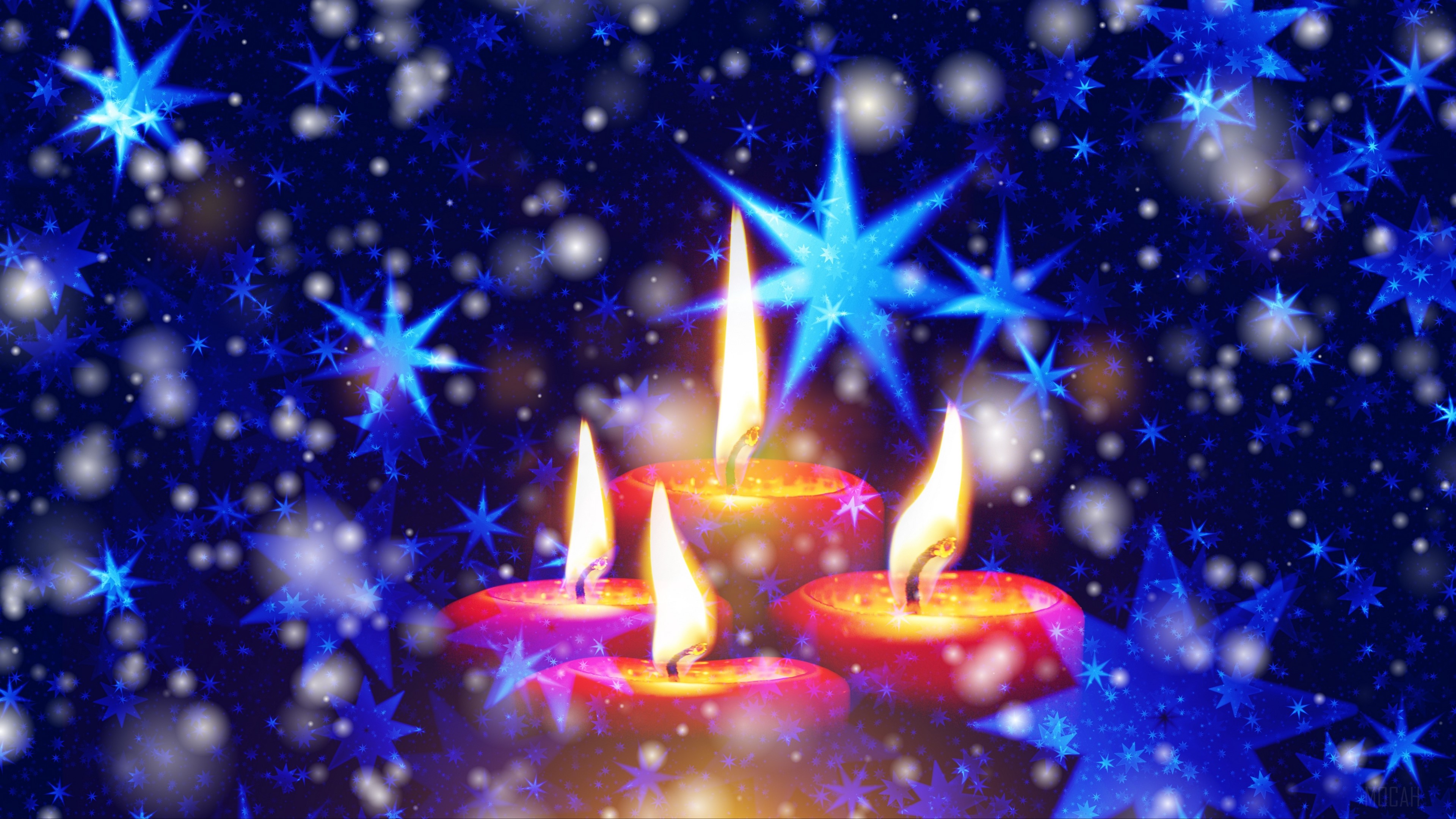 Four lit candles with blue stars and snowflakes HD Wallpaper