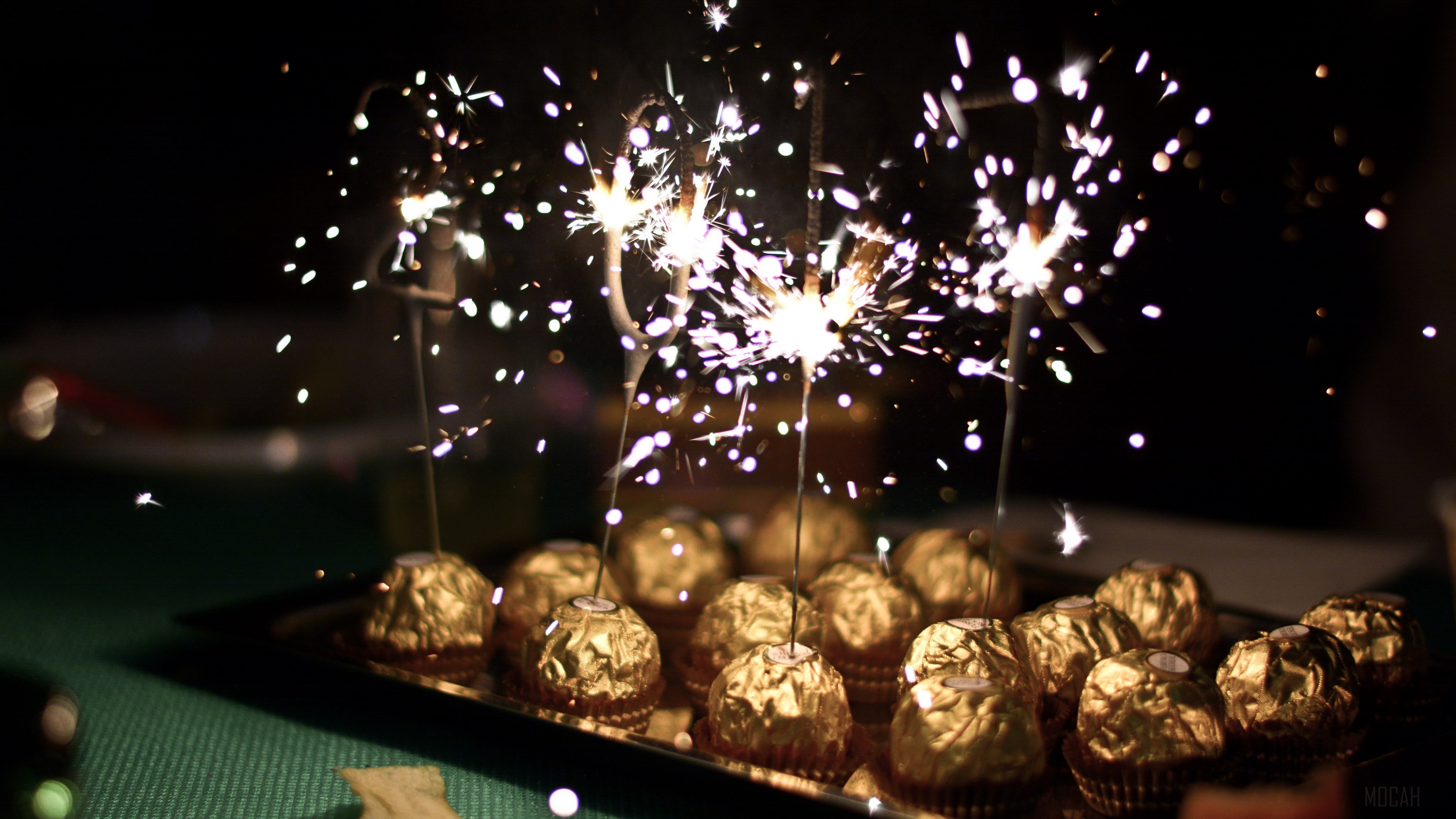 Ferrero Rocher chocolates with sparklers HD Wallpaper