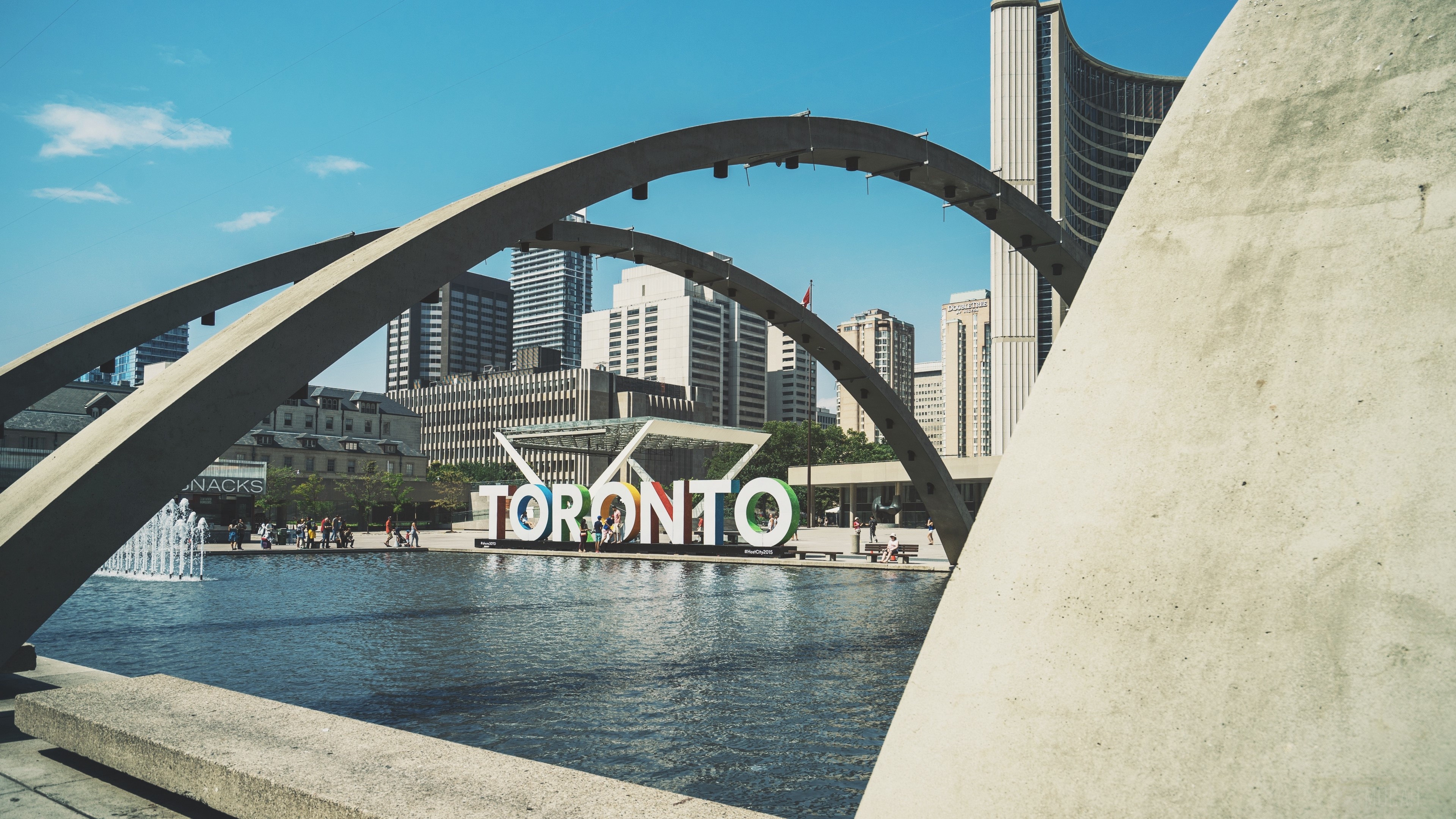 Toronto sign with city skyline and arches HD Wallpaper