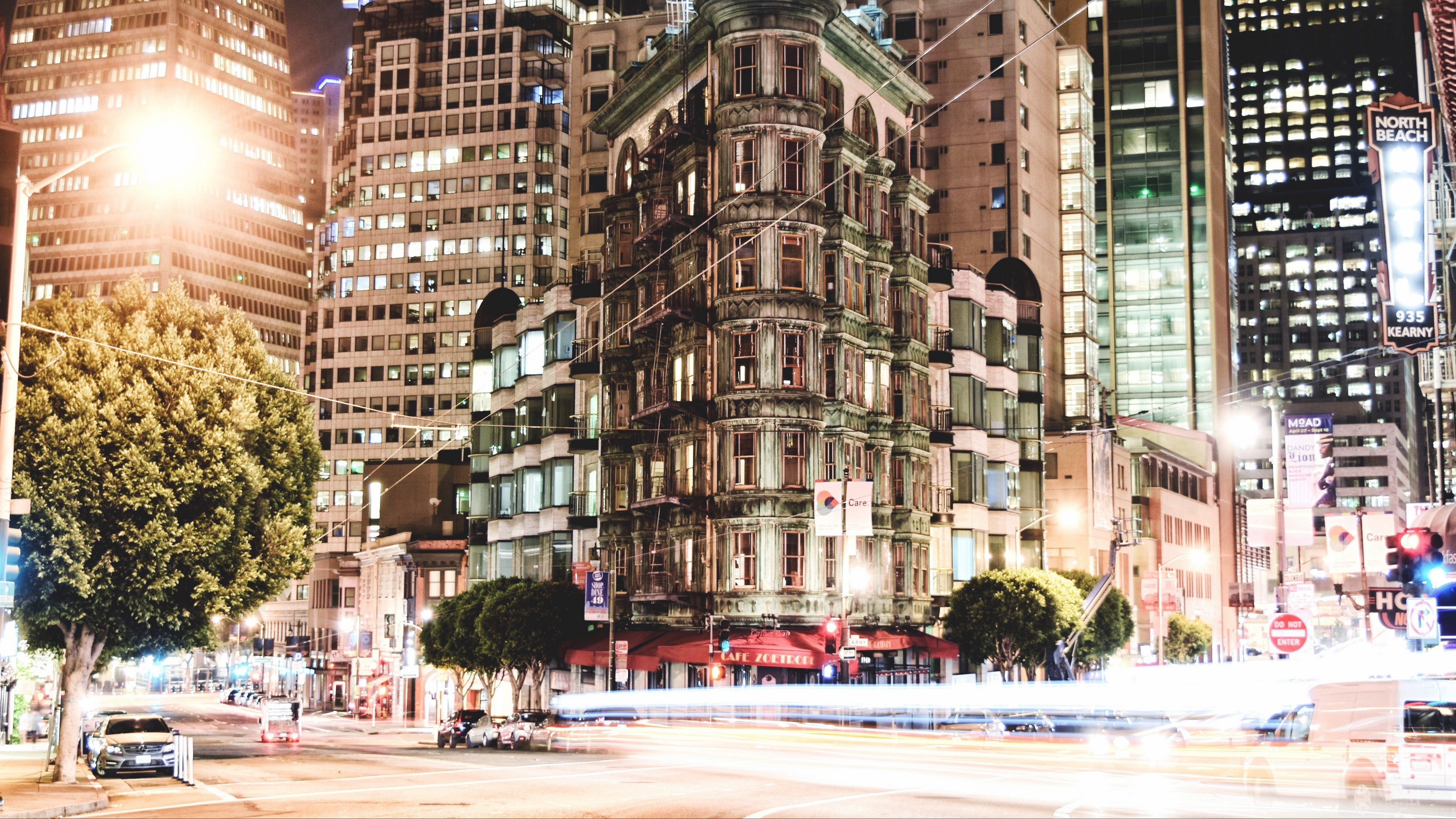 Cityscape at Night with Tall Buildings and Traffic HD Wallpaper