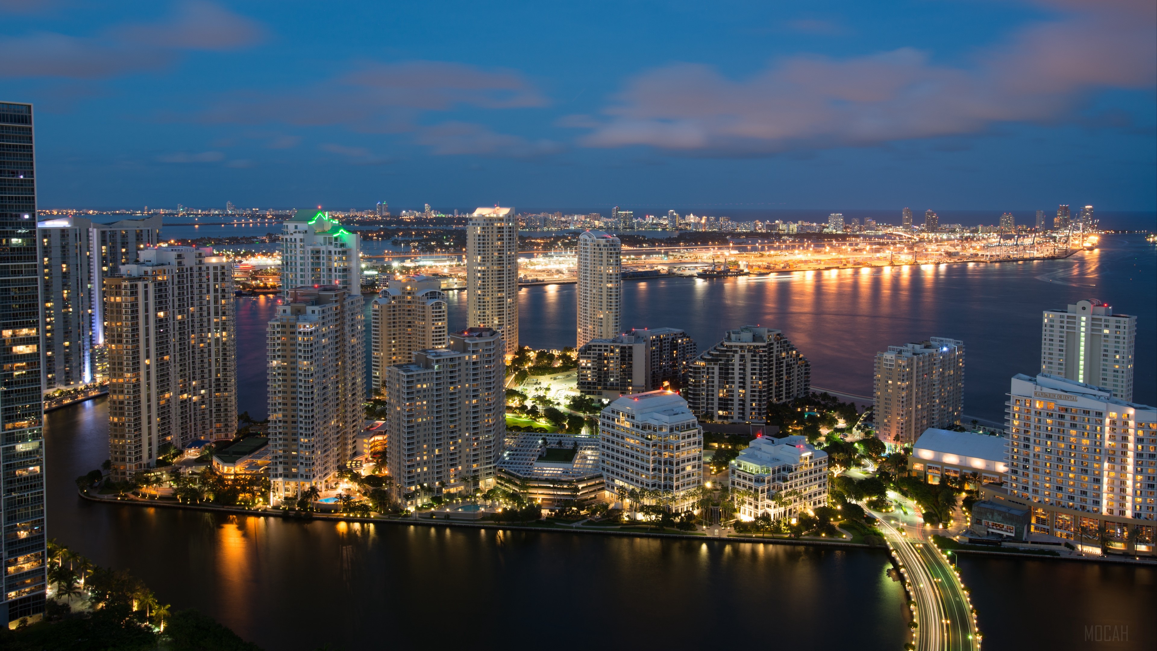 Miami skyline at night with city lights and skyscrapers HD Wallpaper