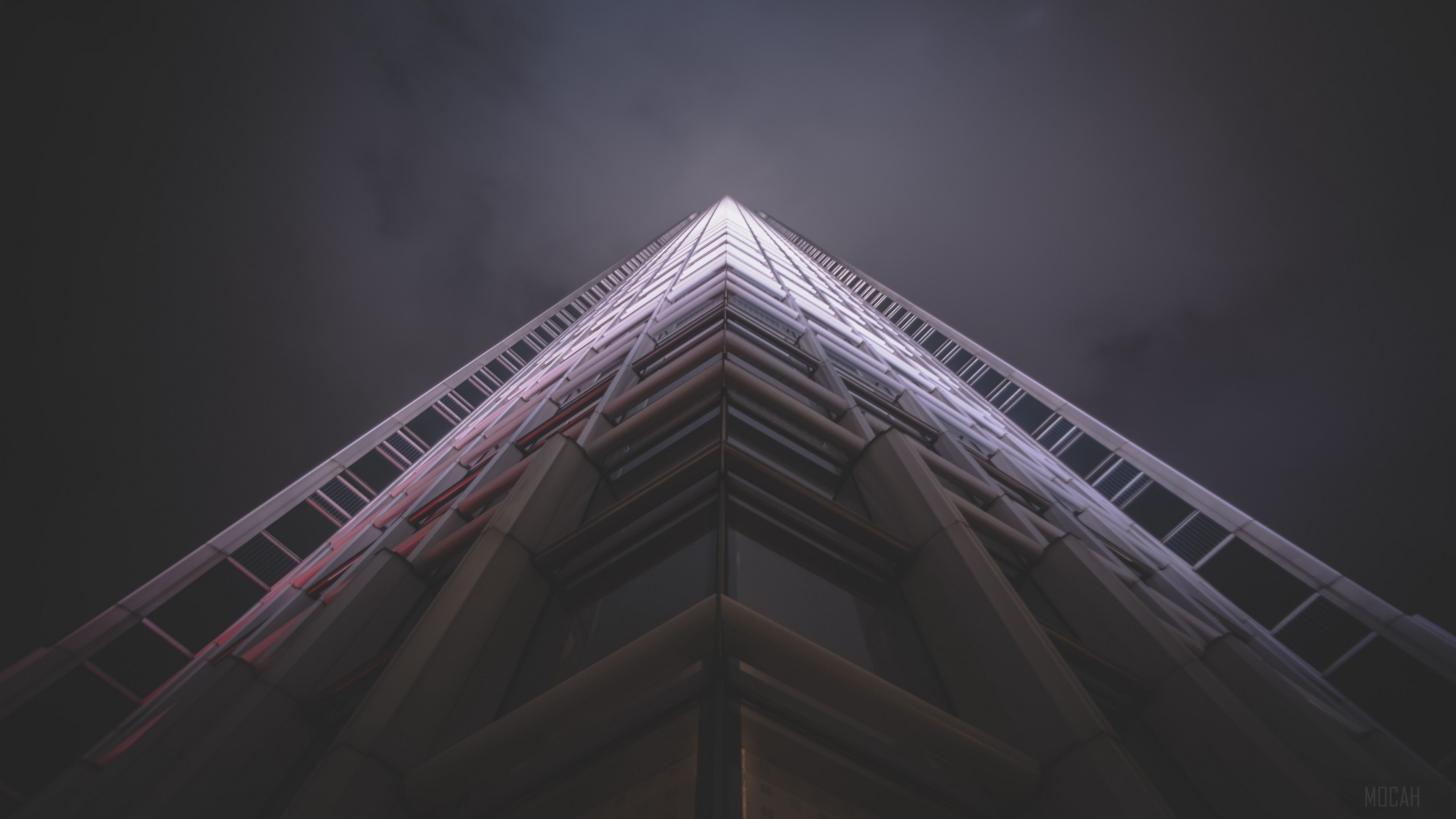 Skyscraper facade from below at night 4K HD Wallpaper