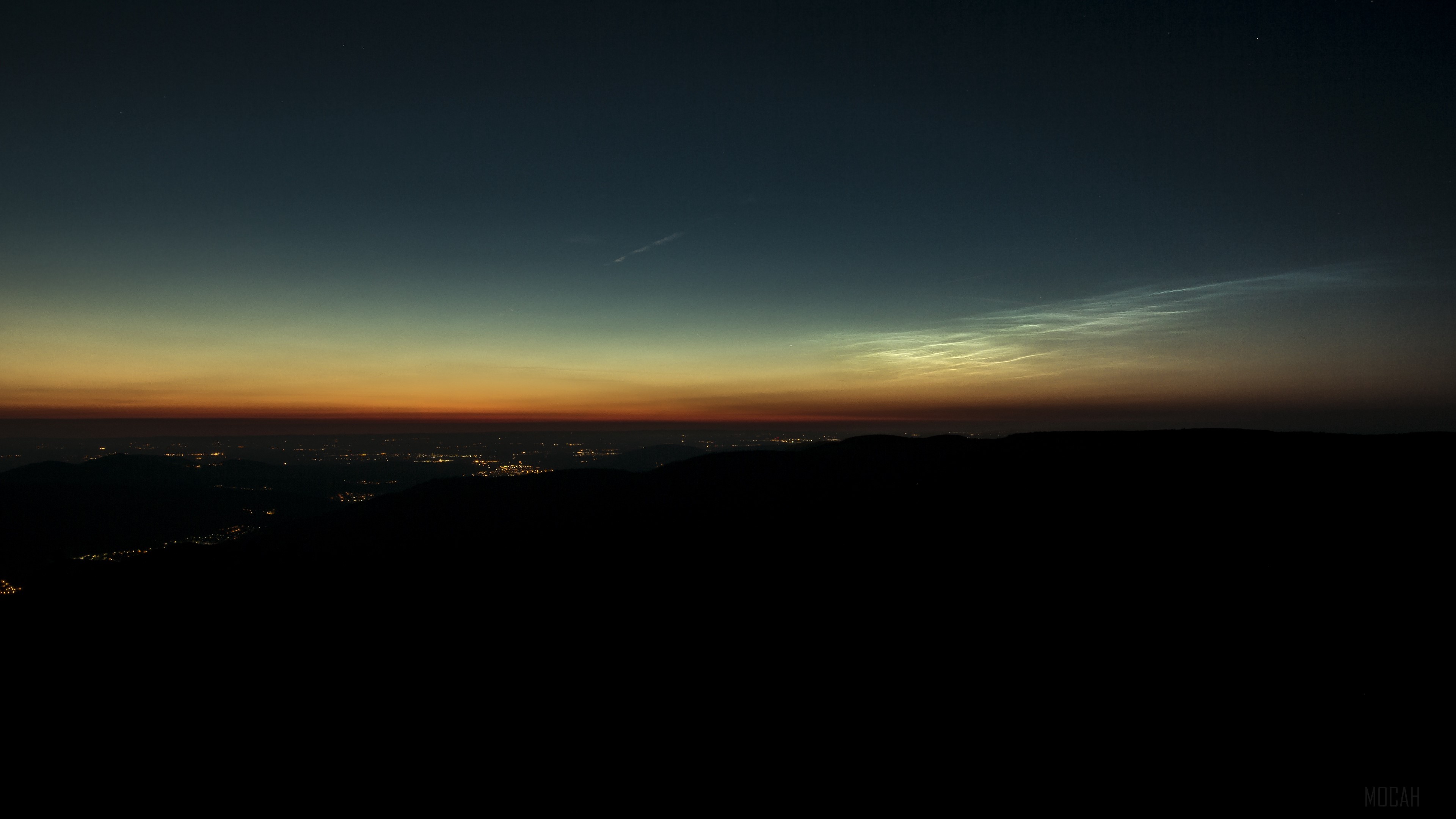 Noctilucent clouds over a city at night HD Wallpaper