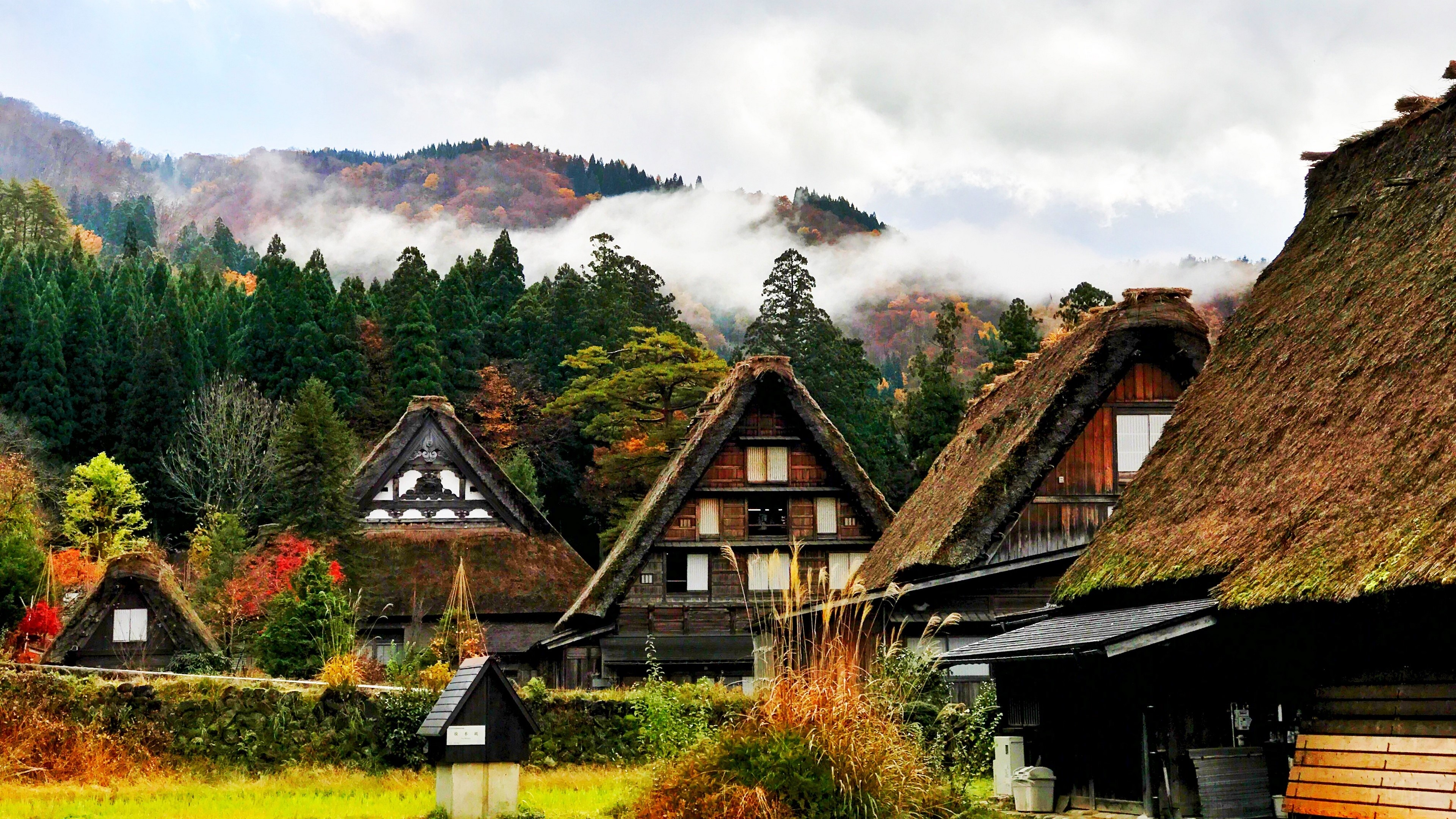 Shirakawa village houses in autumn mountains 4K HD Wallpaper