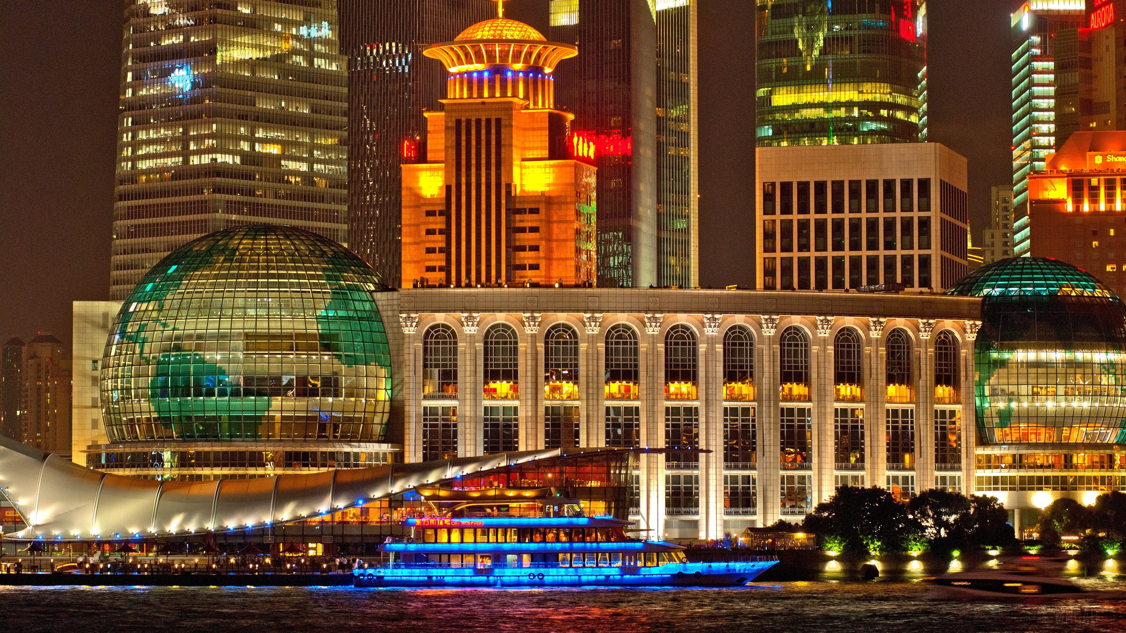 Shanghai skyscrapers at night with a boat HD Wallpaper